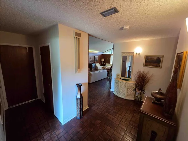 a view of parking garage with cars parked