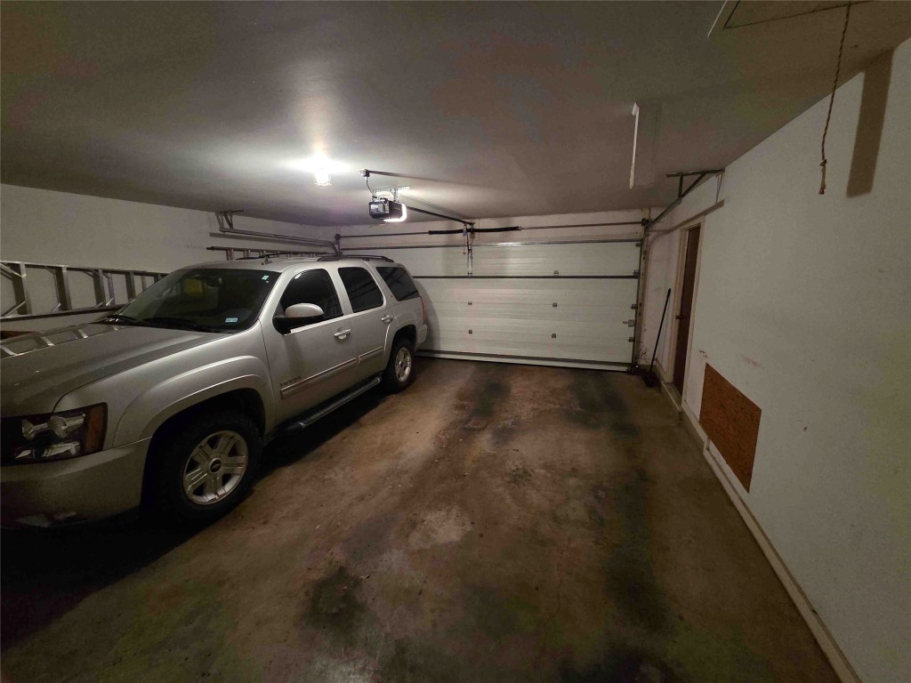 402 Honeycomb Ridge Austin, TX 78746 - Photo 38 of 40 a view of parking garage with cars parked