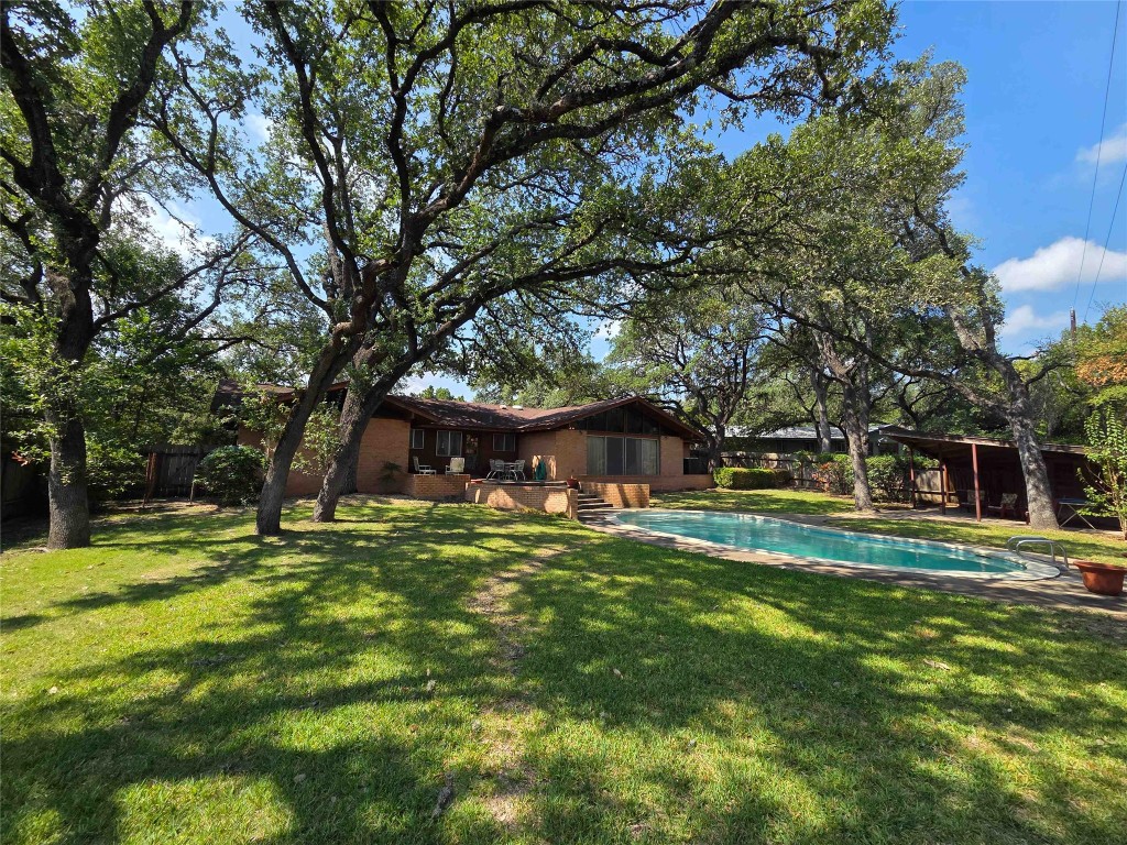 402 Honeycomb Ridge Austin, TX 78746 - Photo 4 of 40 a fire hydrant in the middle of a field