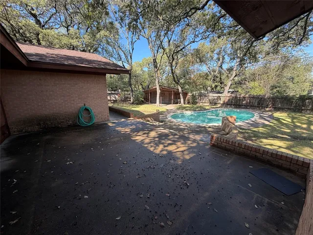 a view of yard with car parked