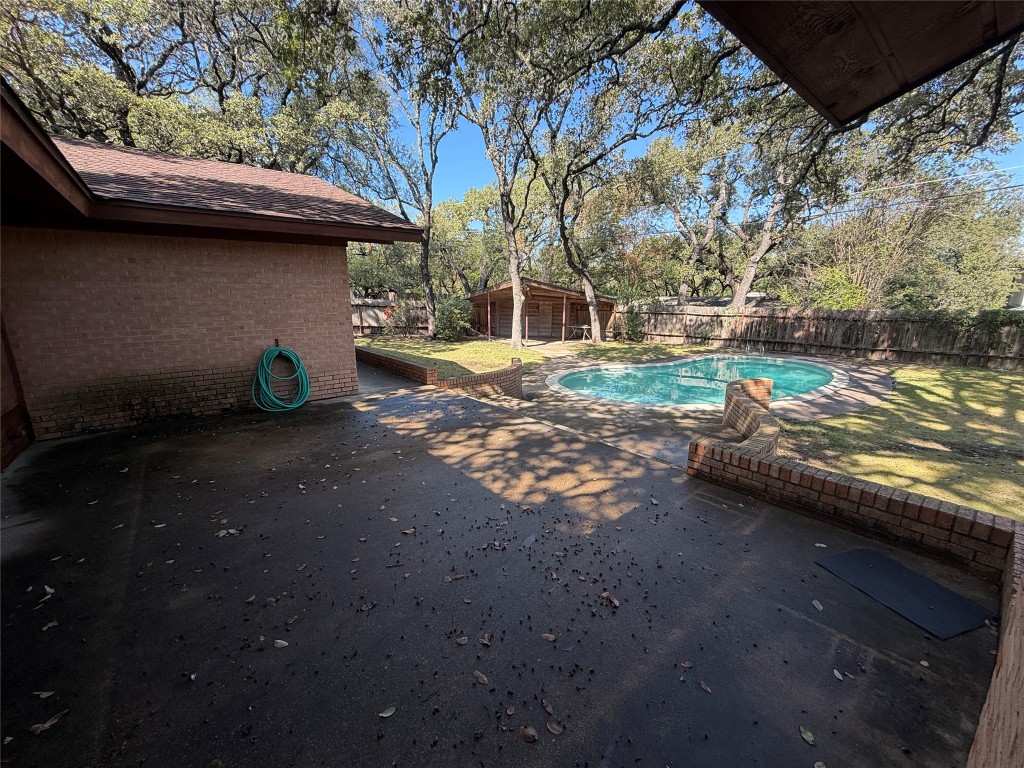 402 Honeycomb Ridge Austin, TX 78746 - Photo 5 of 40 a view of yard with car parked