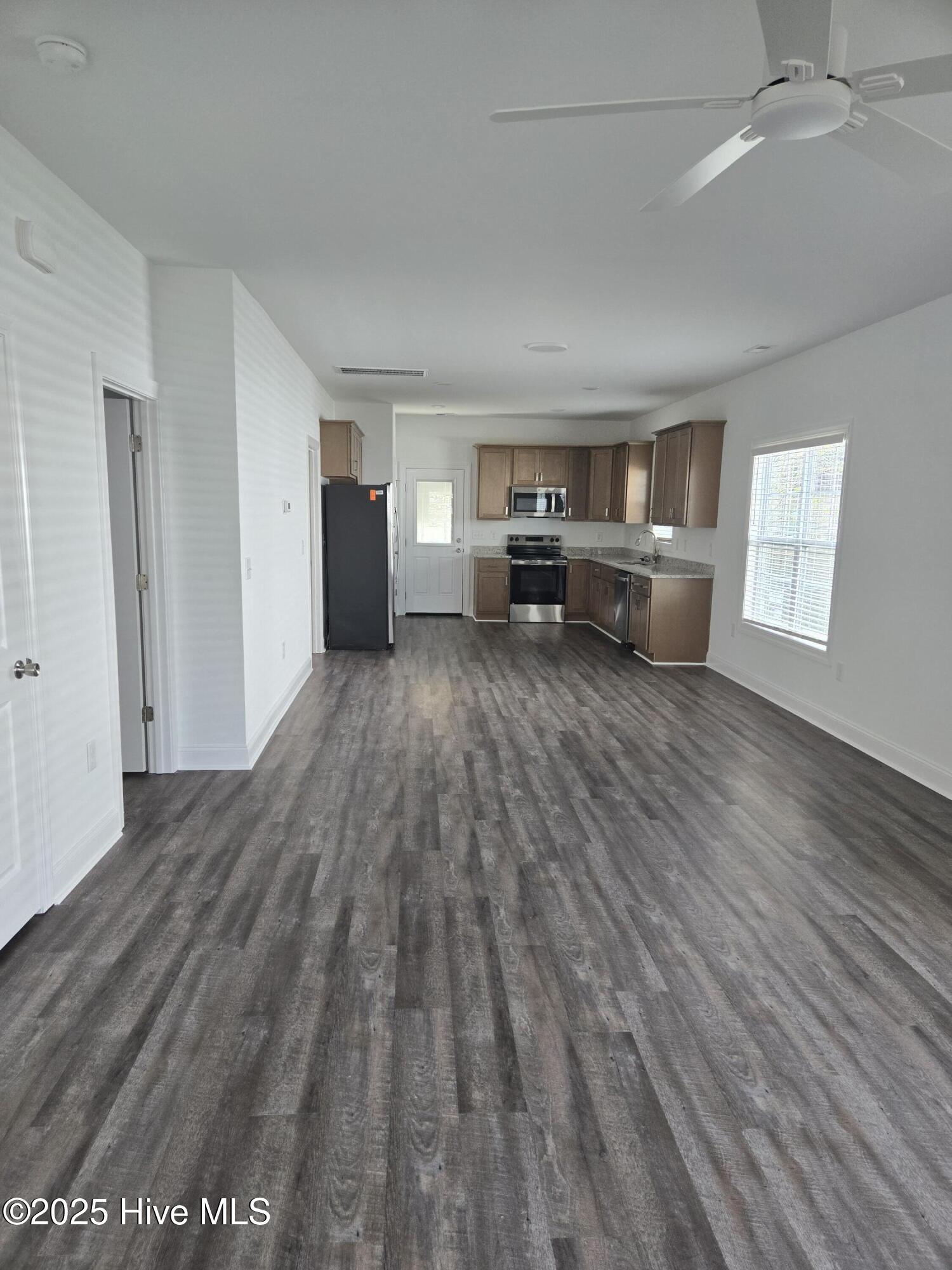 813 Sarah Rebecca Drive, Unit B Greenville, NC 27834 - Photo 2 of 5 Livingrooom to kitchen
