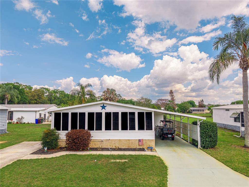 2527 Longpine Lane St. Cloud, FL 34772 - Photo 2 of 42 a view of a house with a yard