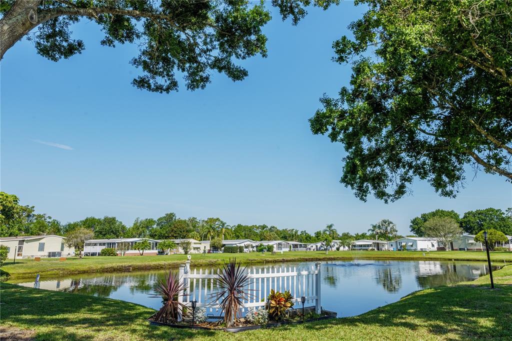 2527 Longpine Lane St. Cloud, FL 34772 - Photo 23 of 42 a view of a lake with houses in the back