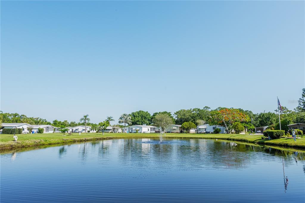 2527 Longpine Lane St. Cloud, FL 34772 - Photo 24 of 42 a view of a lake with houses in the back