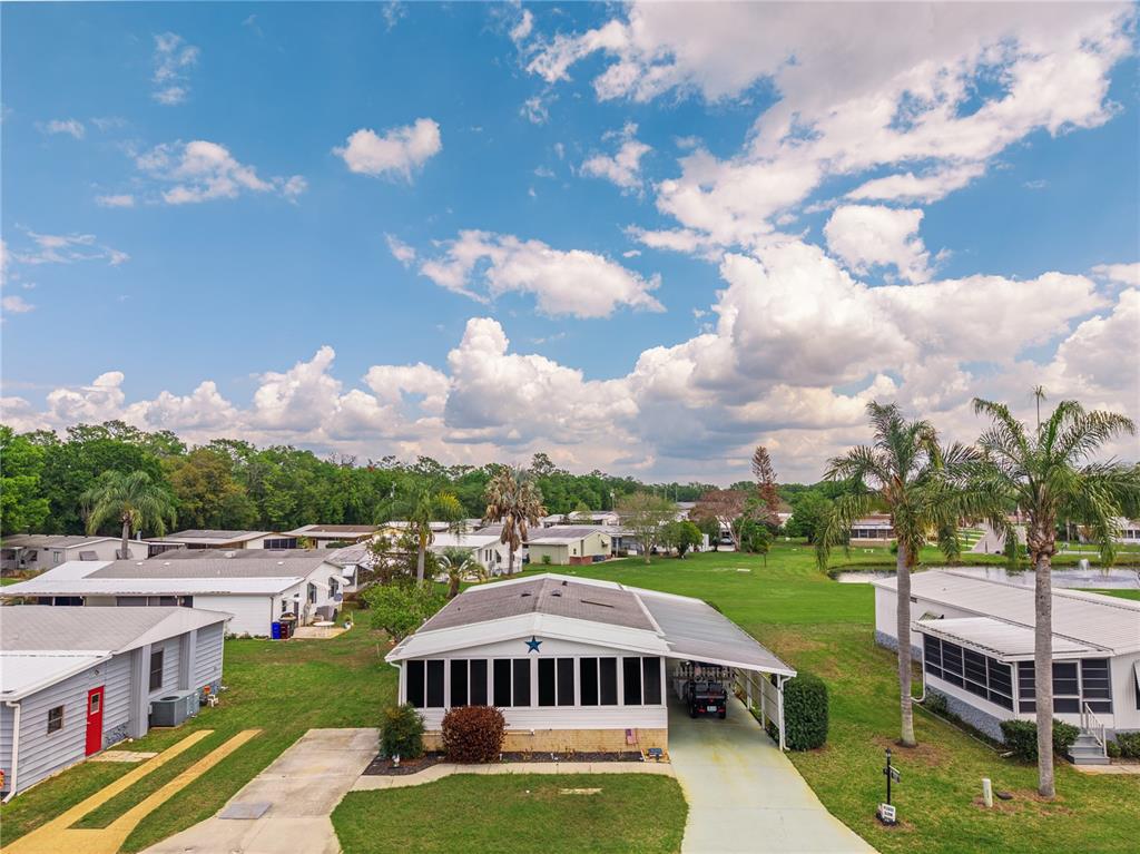 2527 Longpine Lane St. Cloud, FL 34772 - Photo 41 of 42 a view of a house with a yard in front of it