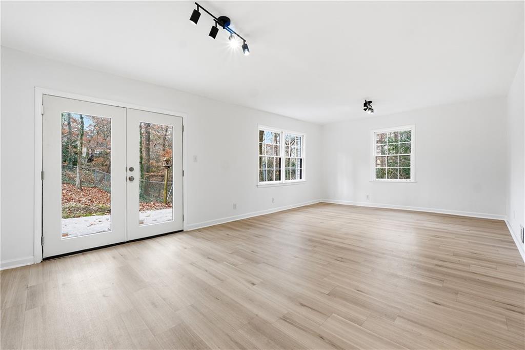 2520 Overlook Way Northeast Atlanta, GA 30345 - Photo 21 of 31 an empty room with wooden floor and windows