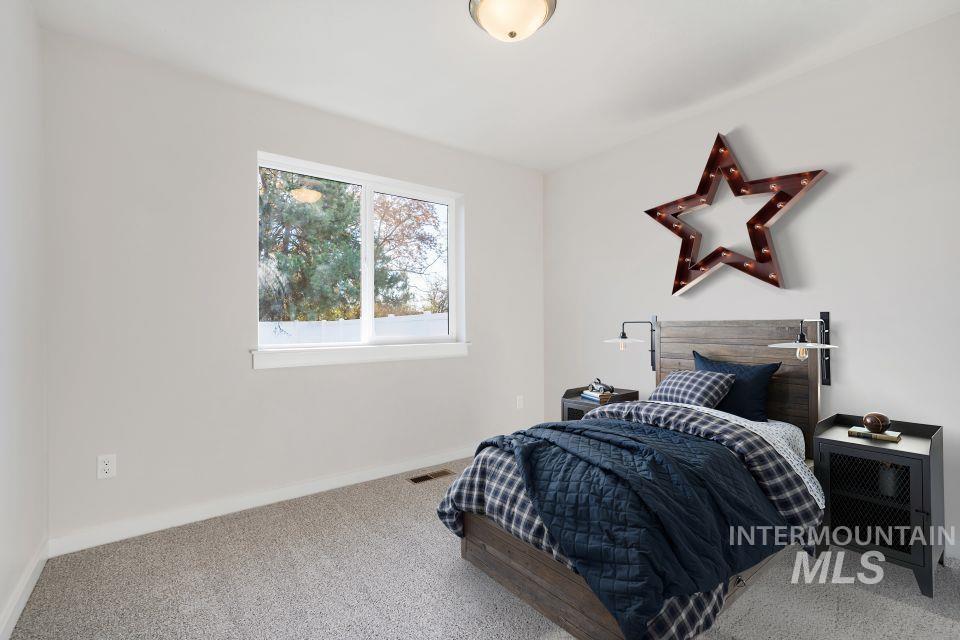 985 Twilight Street Weiser, ID 83672 - Photo 24 of 32 Carpeted bedroom featuring baseboards