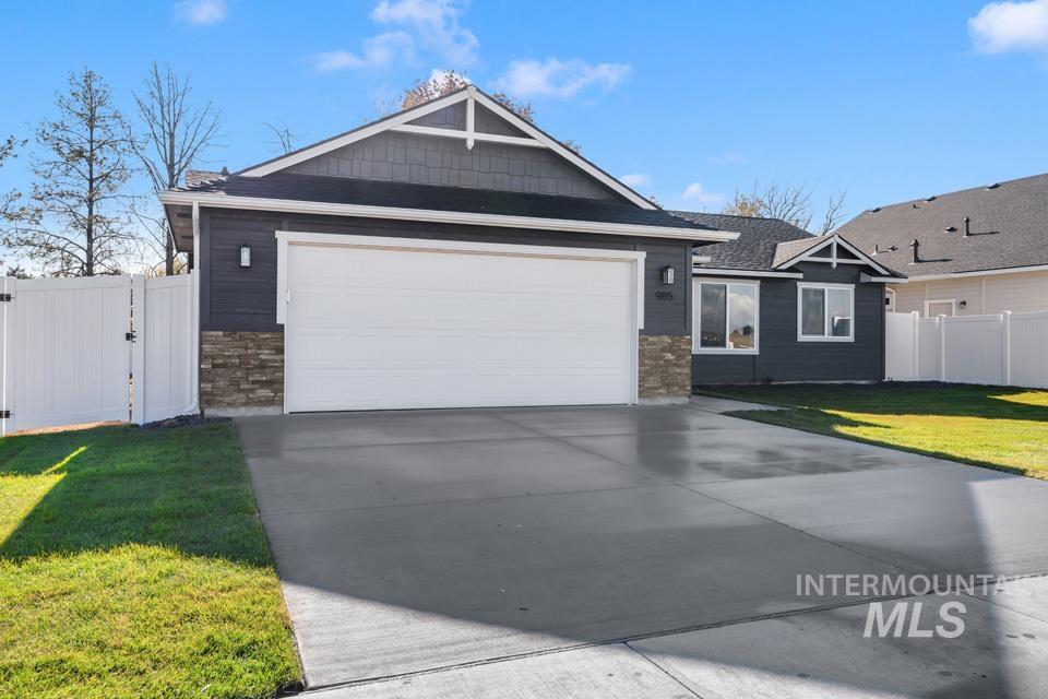 985 Twilight Street Weiser, ID 83672 - Photo 28 of 32 Single story home featuring concrete driveway and a gate