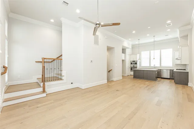 a view of a kitchen with a sink and a cabinet
