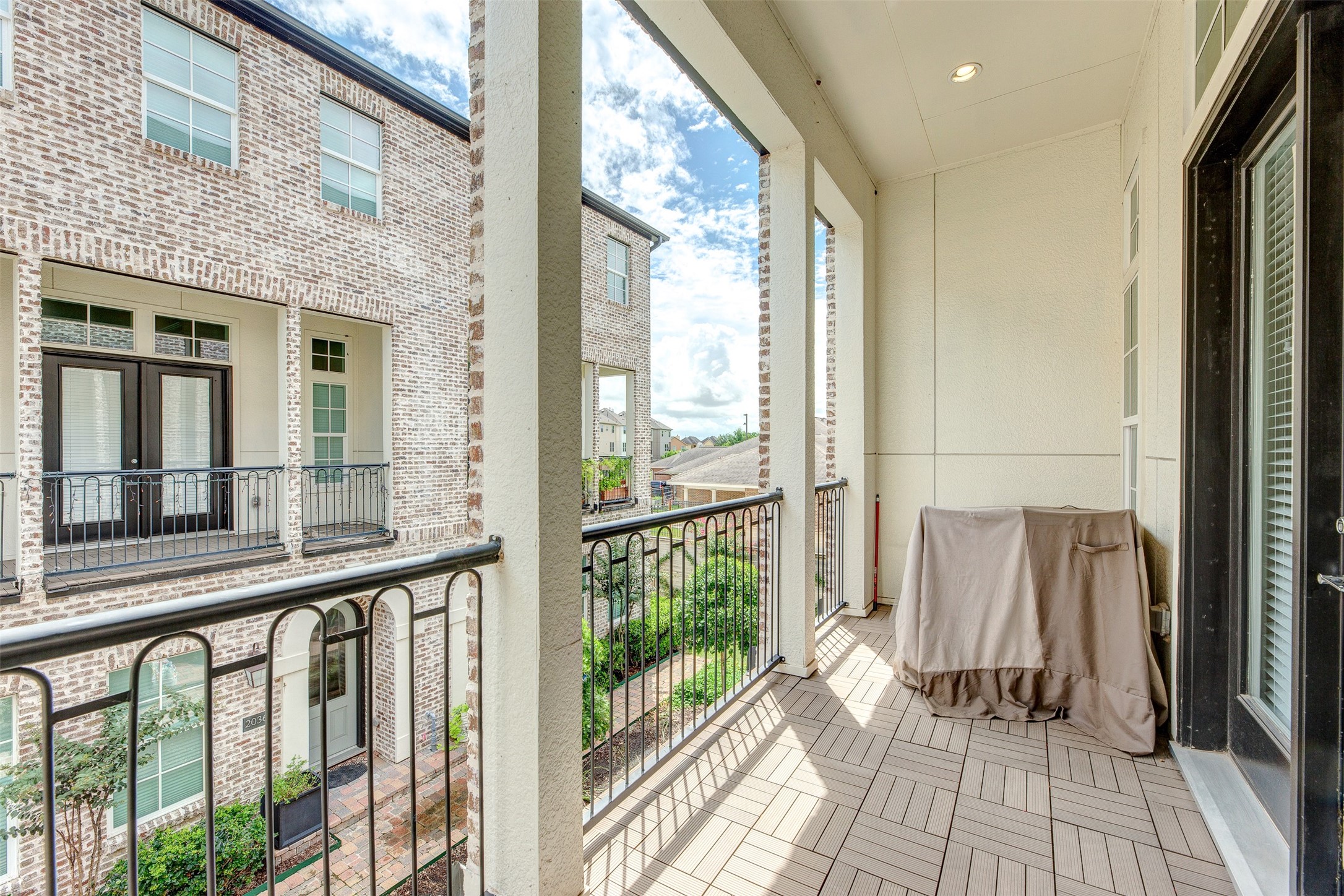2028 Waterloo Station Road Houston, TX 77045 - Photo 13 of 34 a view of a balcony with wooden floor and door