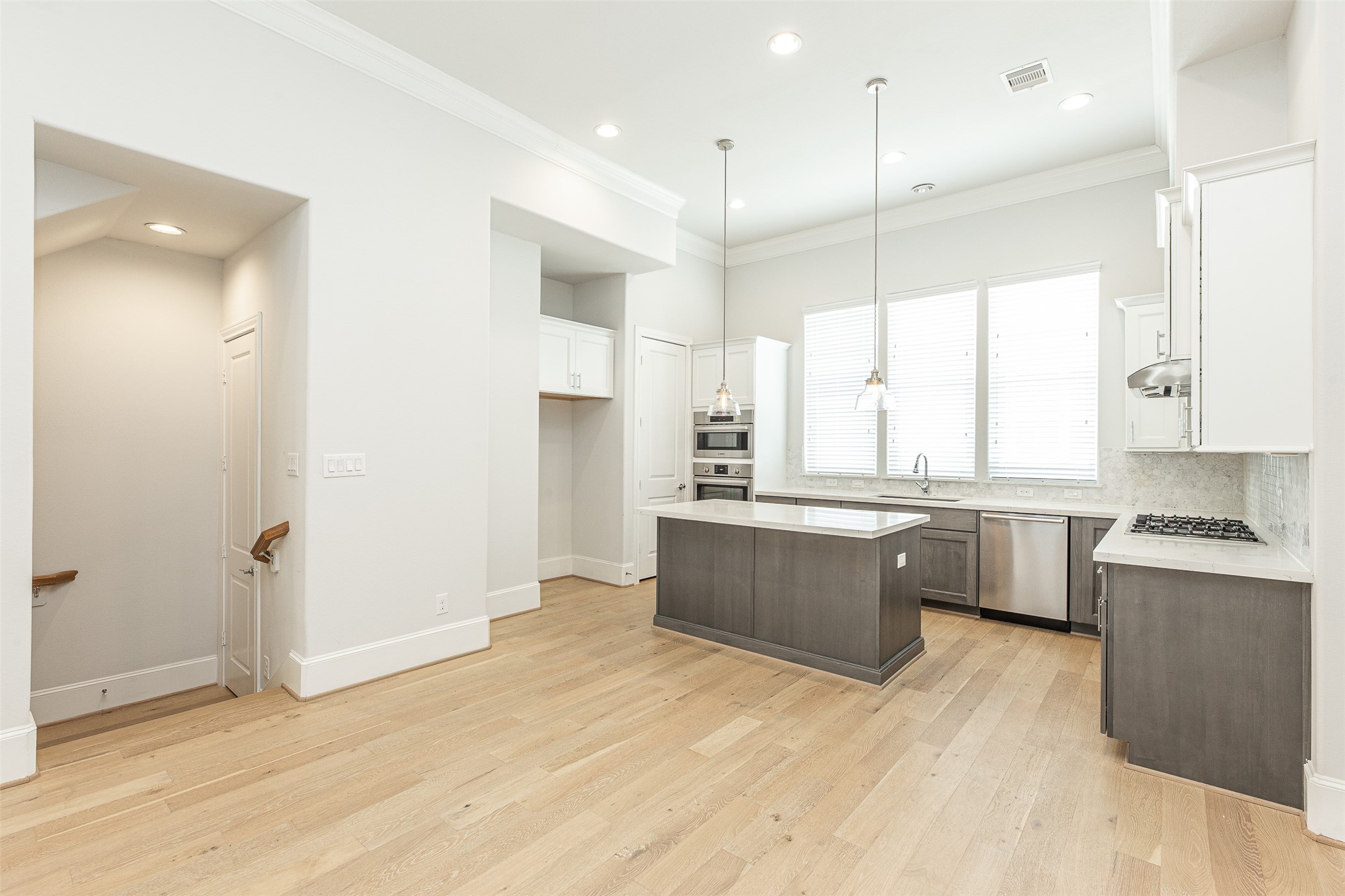 2028 Waterloo Station Road Houston, TX 77045 - Photo 14 of 34 a large kitchen with a window and stainless steel appliances