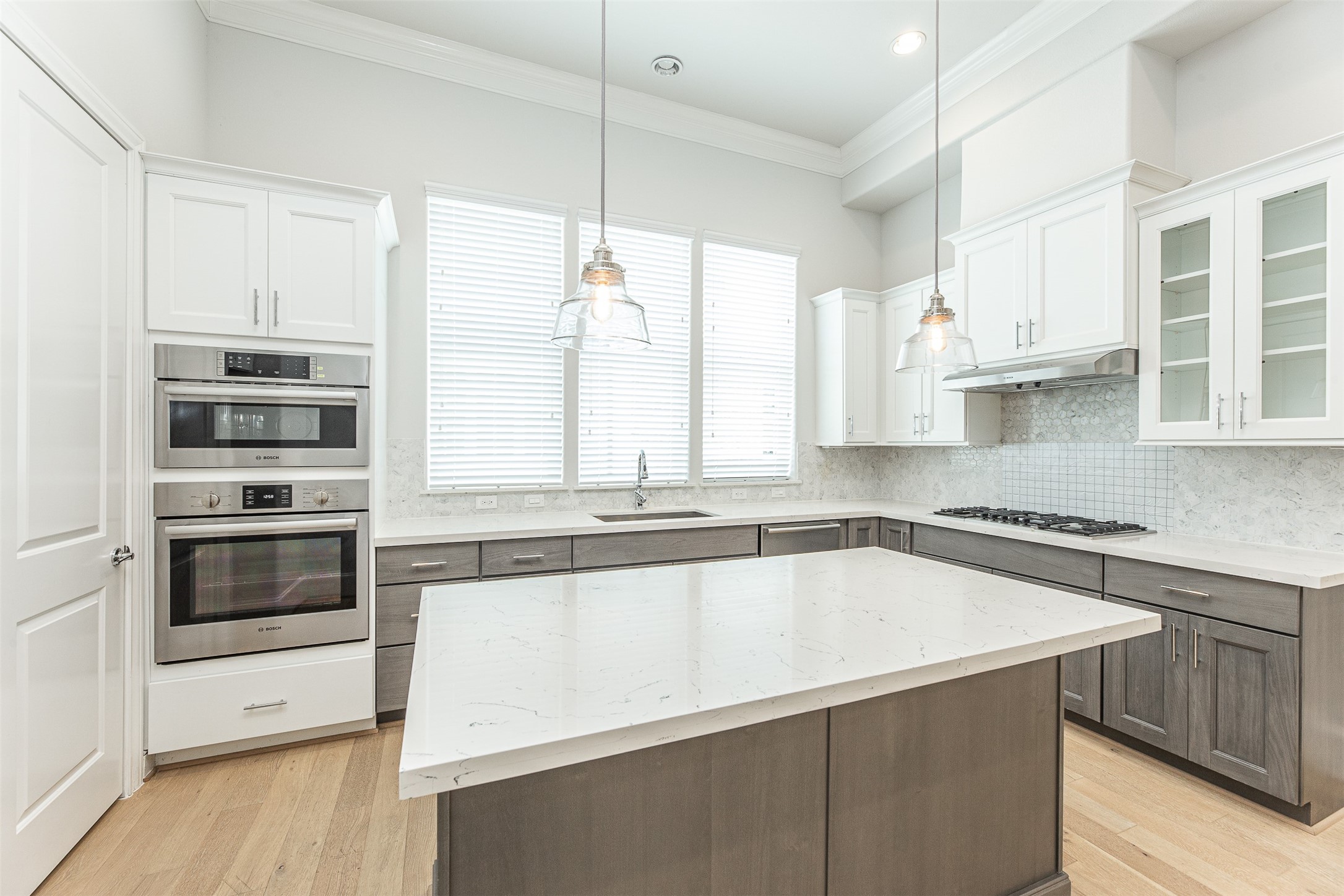 2028 Waterloo Station Road Houston, TX 77045 - Photo 16 of 34 a kitchen with stainless steel appliances a stove sink and cabinets