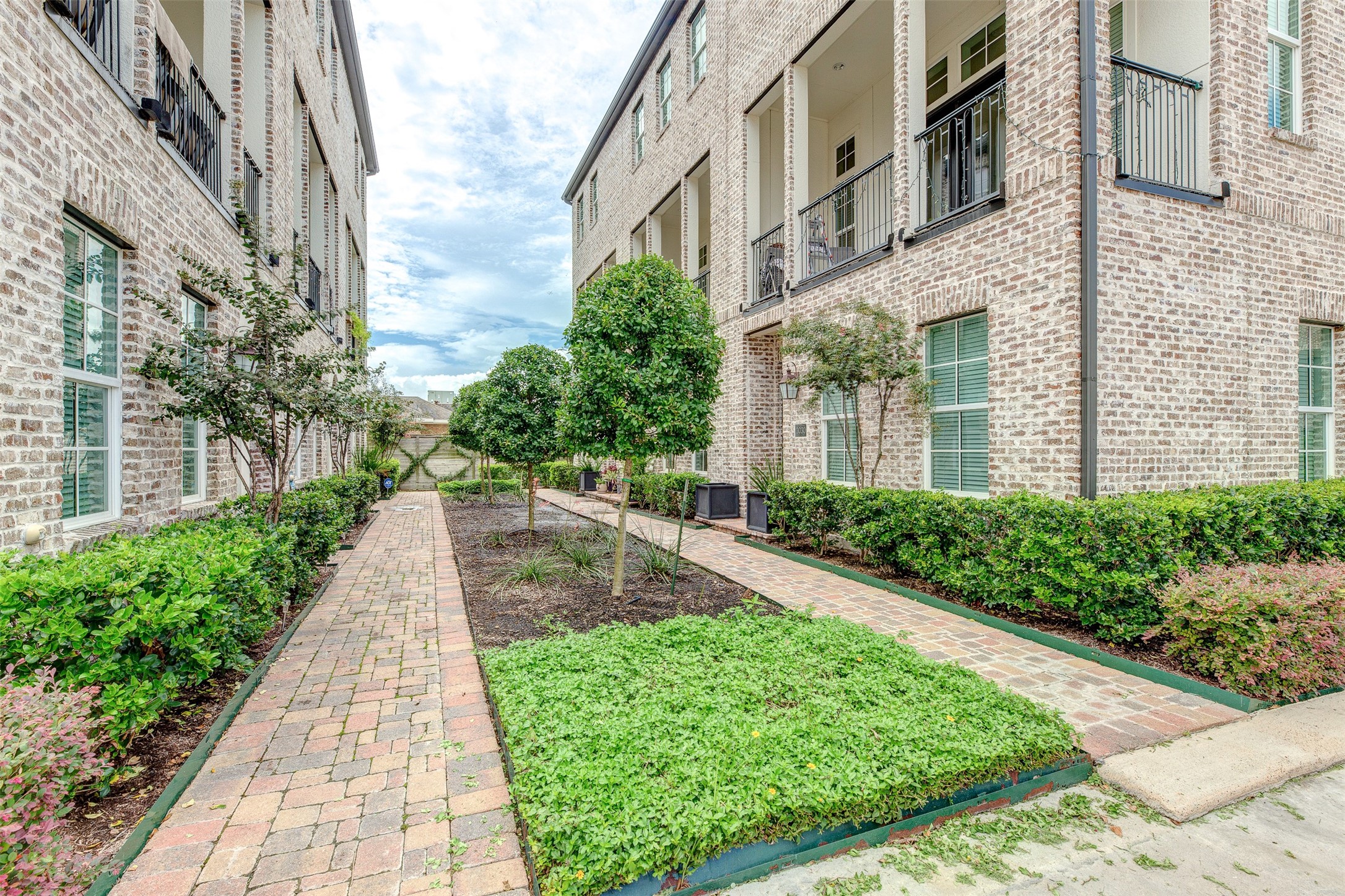 2028 Waterloo Station Road Houston, TX 77045 - Photo 2 of 34 a view of a pathway with house on both side