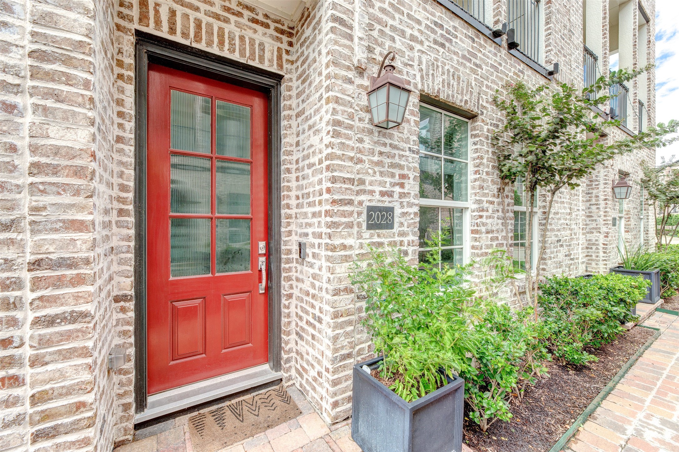 2028 Waterloo Station Road Houston, TX 77045 - Photo 3 of 34 a view of a brick house with a large window