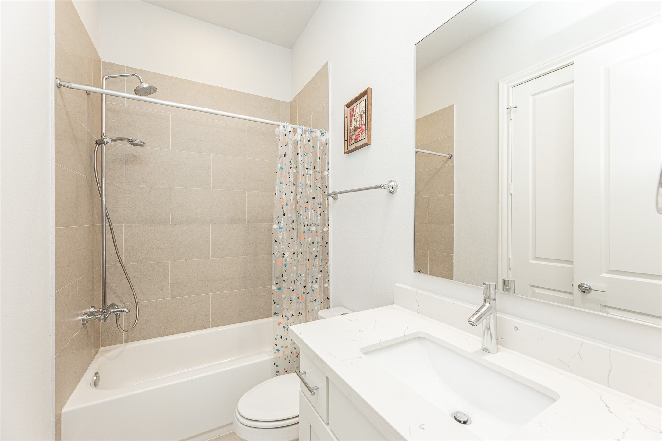 2028 Waterloo Station Road Houston, TX 77045 - Photo 8 of 34 a bathroom with a sink toilet and shower