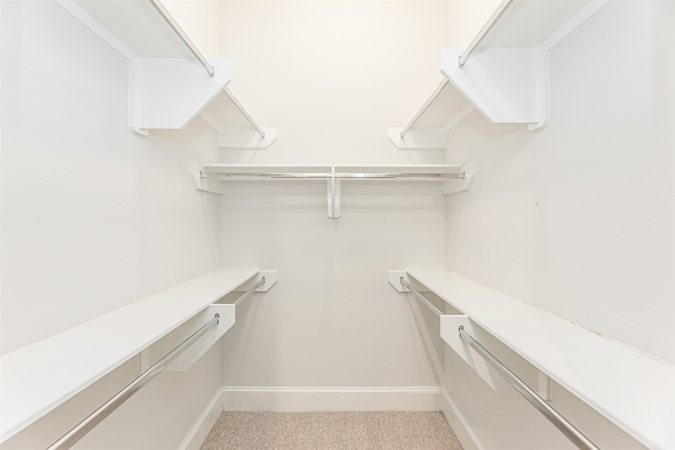 2028 Waterloo Station Road Houston, TX 77045 - Photo 9 of 34 a view of walk in closet with empty racks