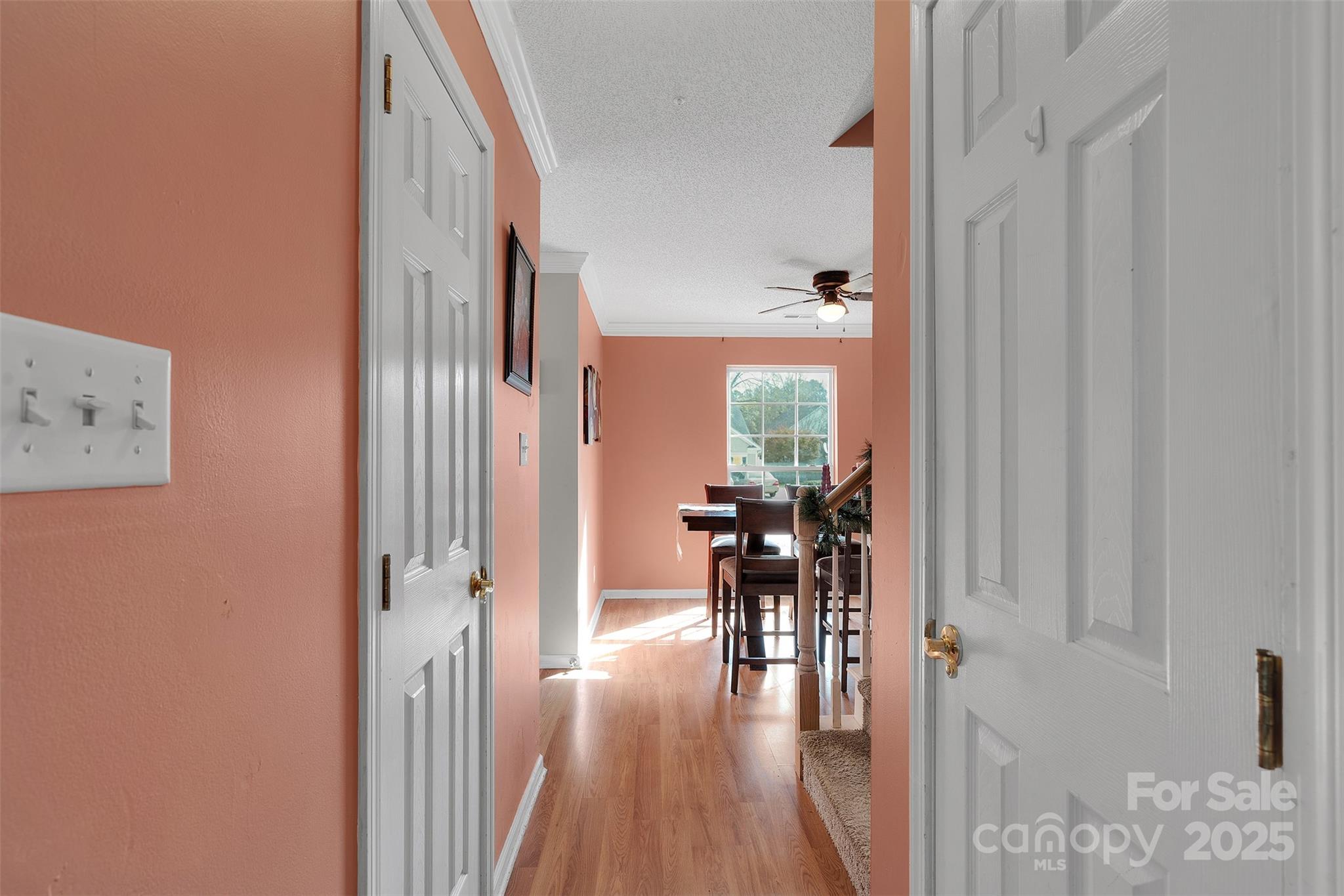 3007 Wyntree Court Matthews, NC 28104 - Photo 11 of 44 a view of a hallway with wooden floor and furniture