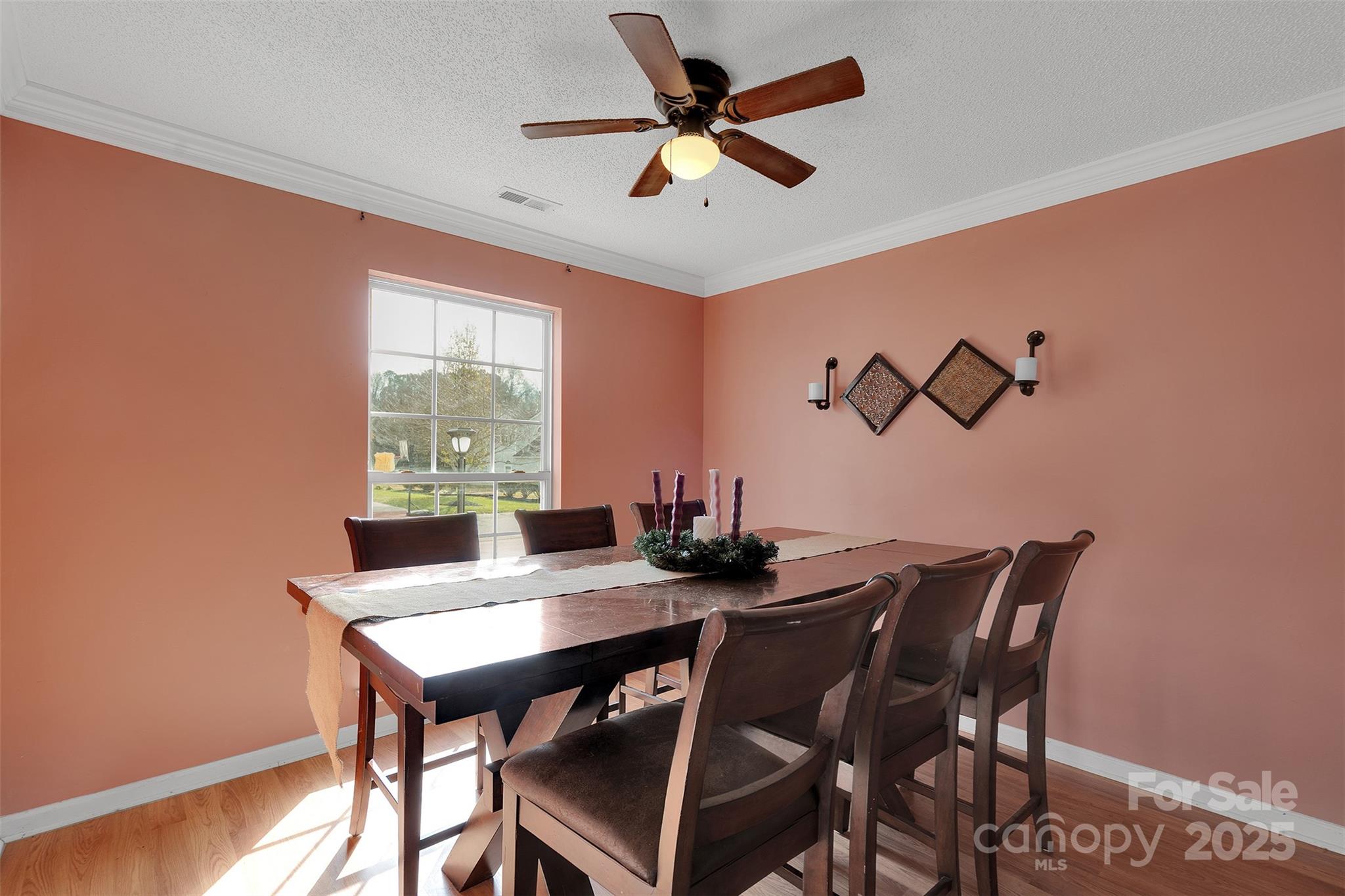 3007 Wyntree Court Matthews, NC 28104 - Photo 12 of 44 a view of a dining room with furniture window and wooden floor