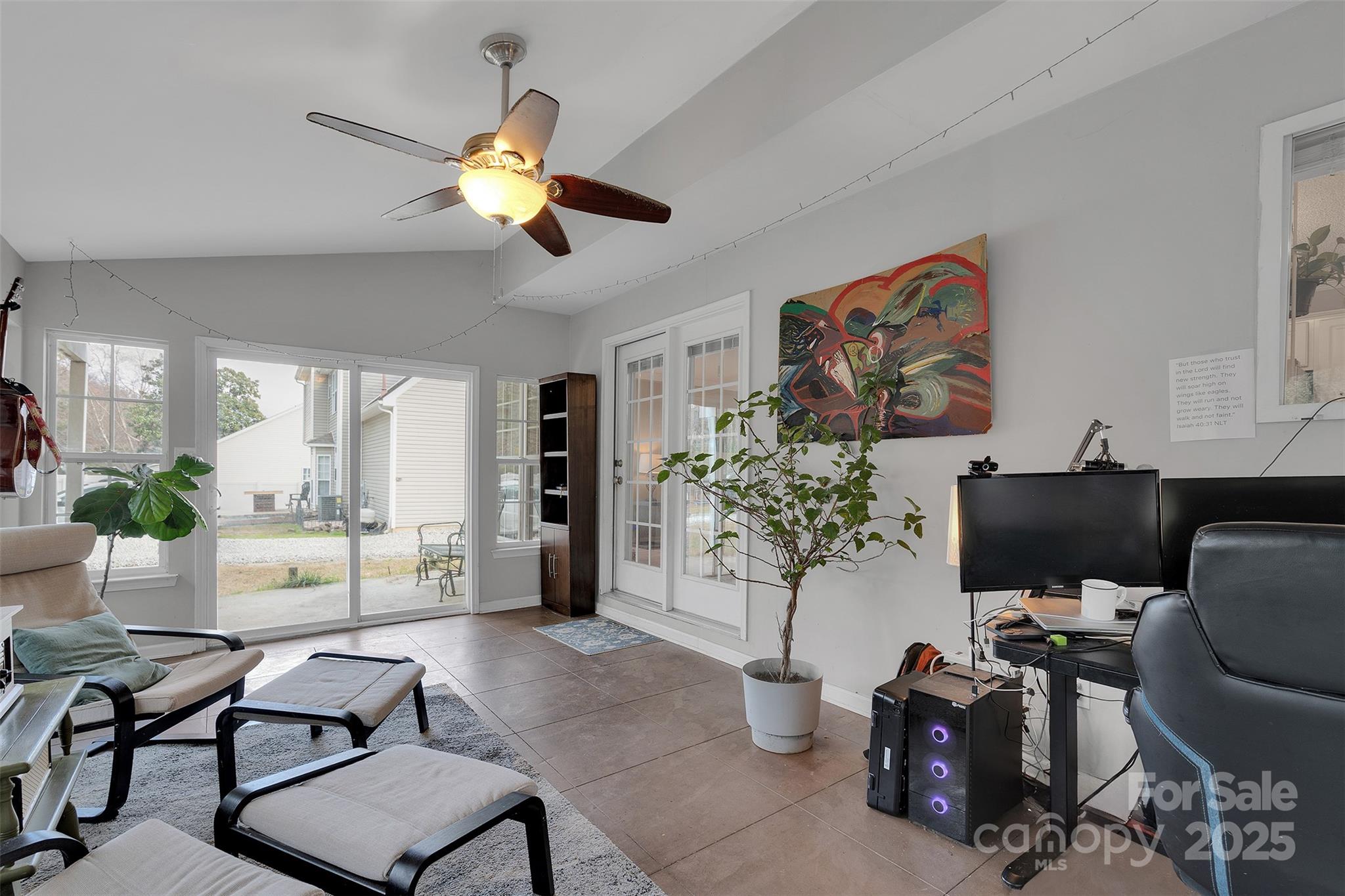 3007 Wyntree Court Matthews, NC 28104 - Photo 17 of 44 a living room with furniture and a chandelier