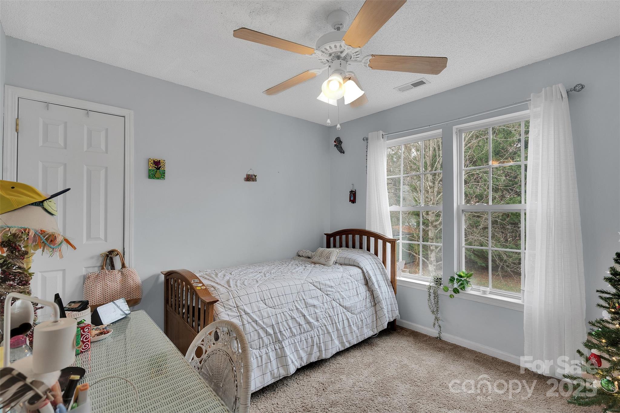 3007 Wyntree Court Matthews, NC 28104 - Photo 19 of 44 a bedroom with a bed and a chandelier