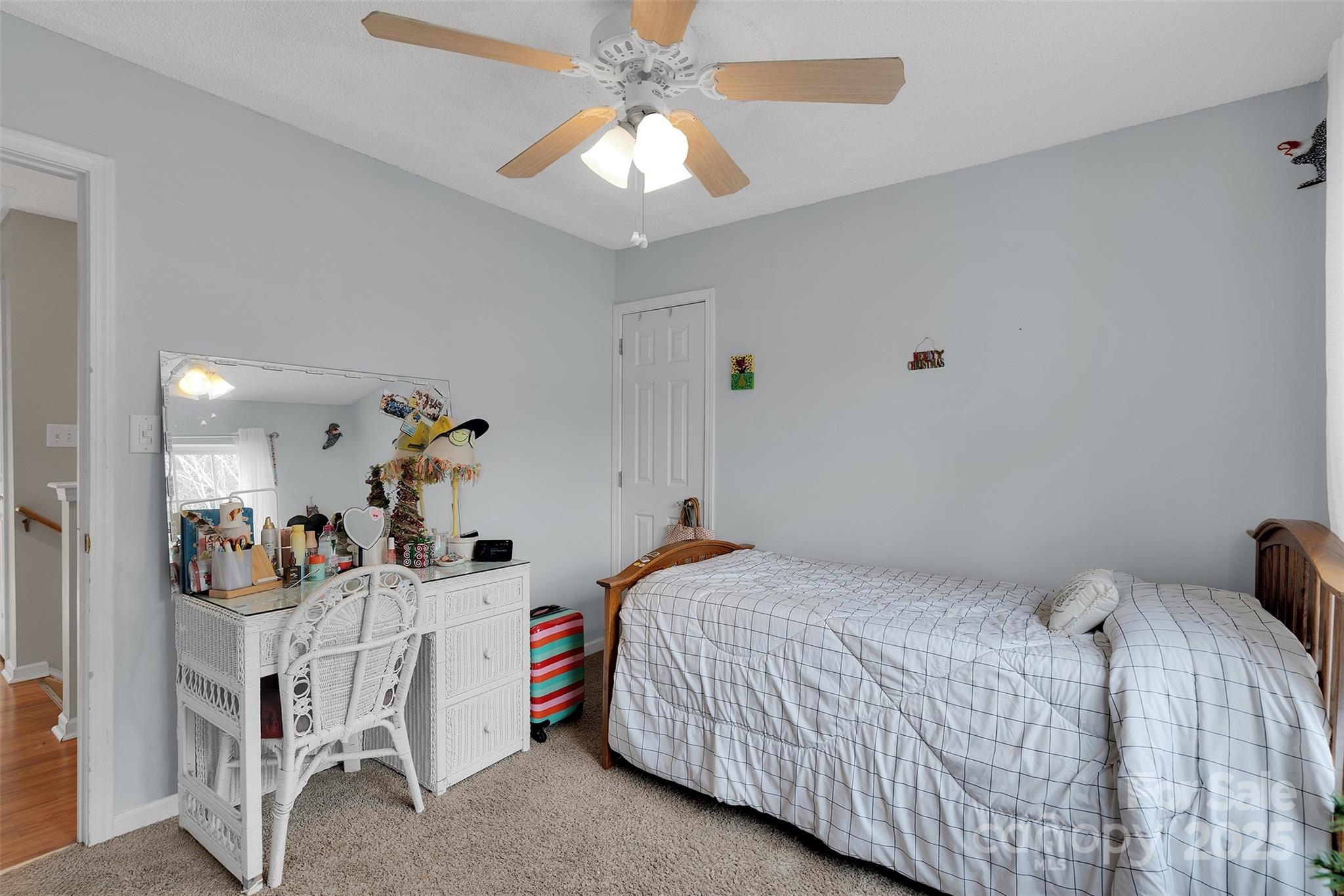 3007 Wyntree Court Matthews, NC 28104 - Photo 20 of 44 a bedroom with a bed and a chandelier