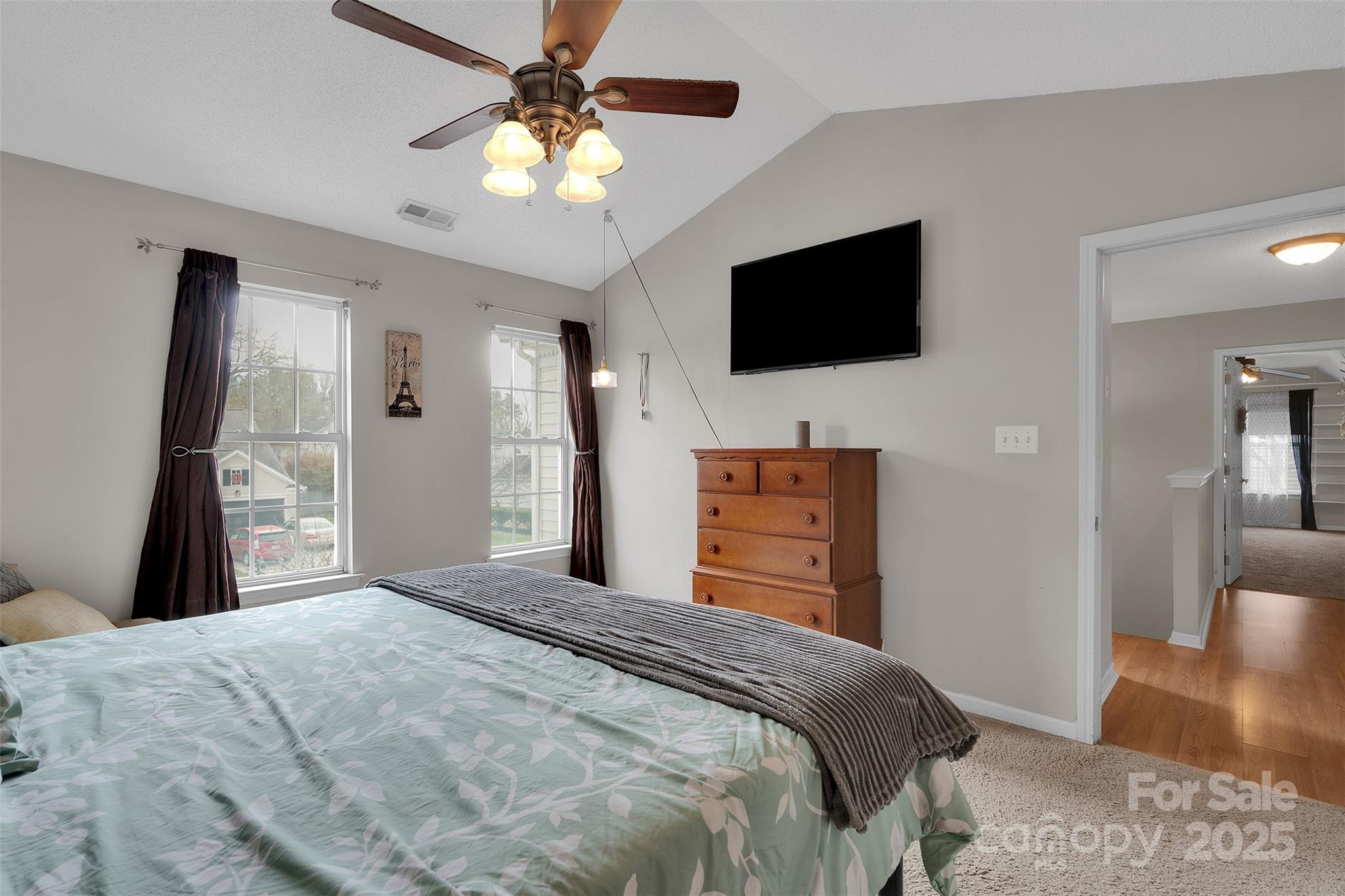 3007 Wyntree Court Matthews, NC 28104 - Photo 30 of 44 a bedroom with a bed and a flat screen tv