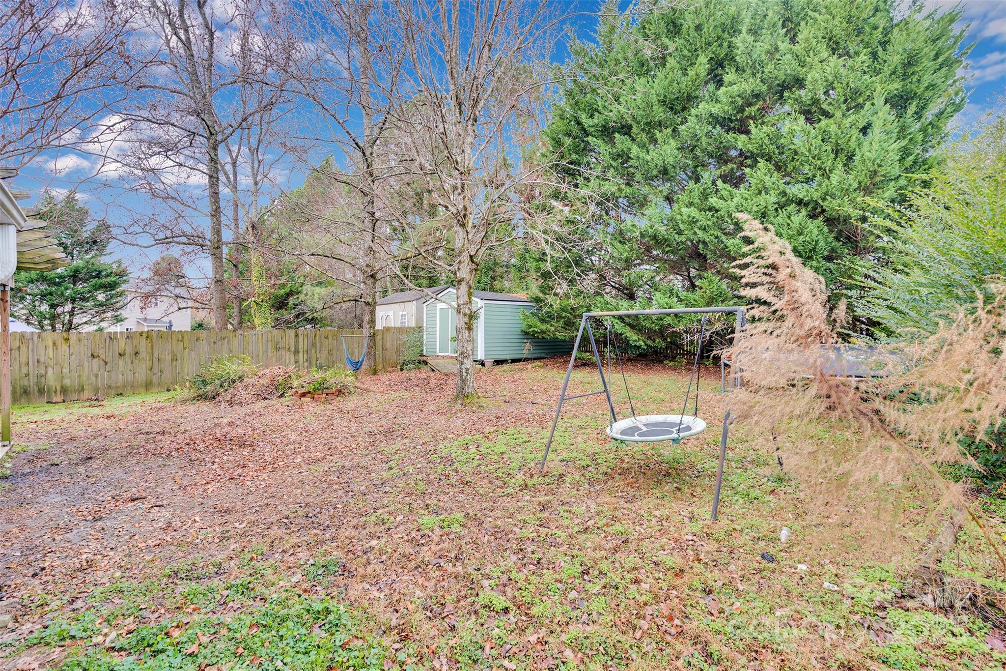 3007 Wyntree Court Matthews, NC 28104 - Photo 36 of 44 a backyard of a house with plants and tree