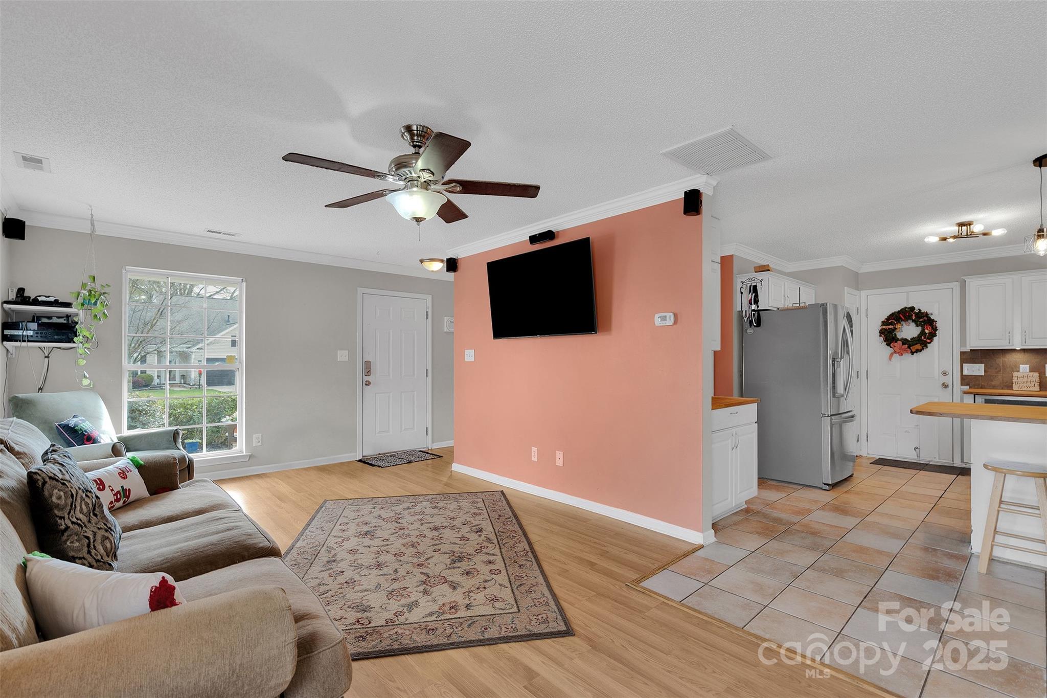 3007 Wyntree Court Matthews, NC 28104 - Photo 6 of 44 a living room with furniture and a flat screen tv