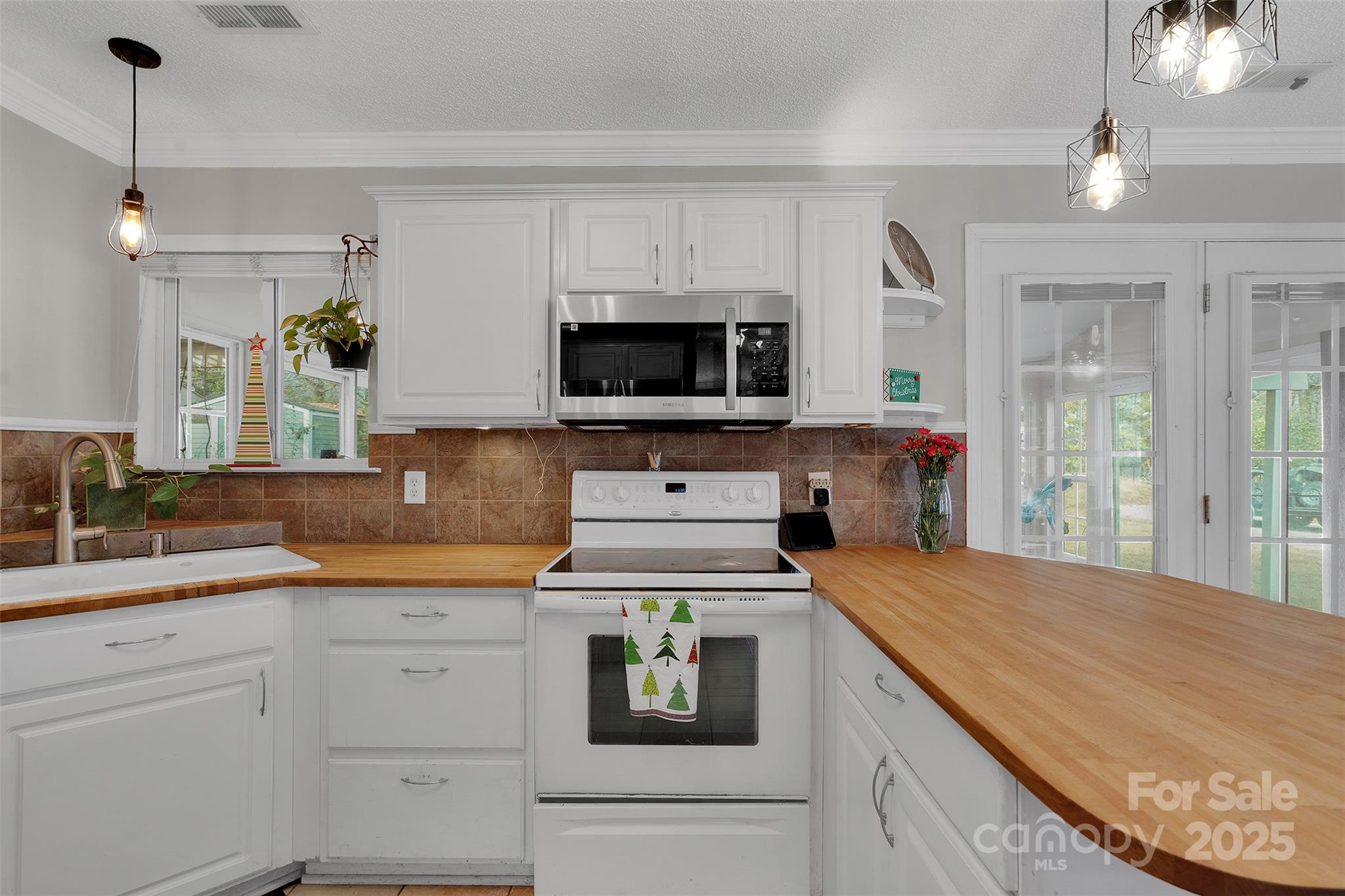 3007 Wyntree Court Matthews, NC 28104 - Photo 9 of 44 a kitchen with a stove and a sink