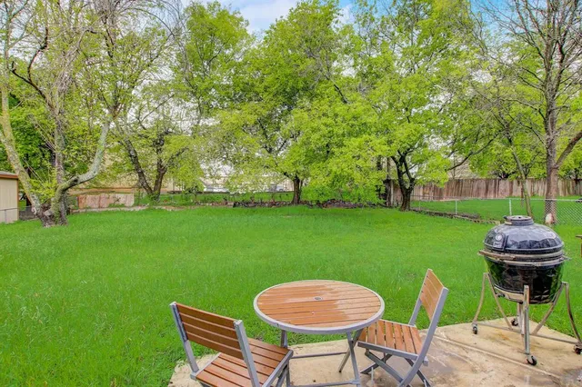a table and chairs in the garden