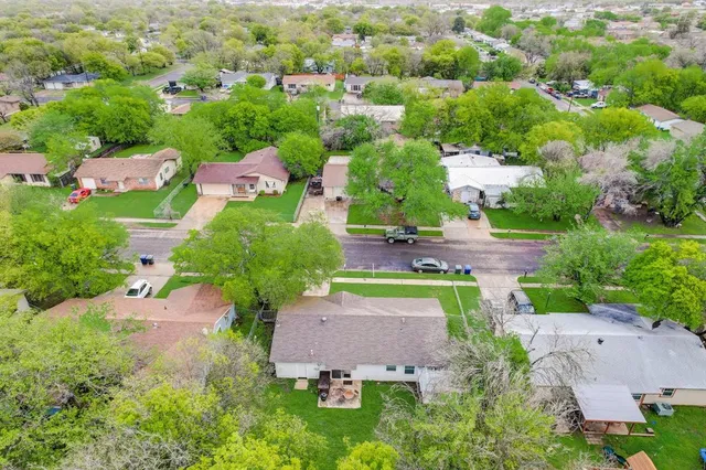 an aerial view of a house with a garden