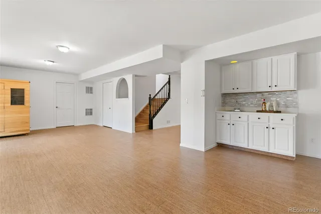 a view of kitchen with cabinets and wooden floor