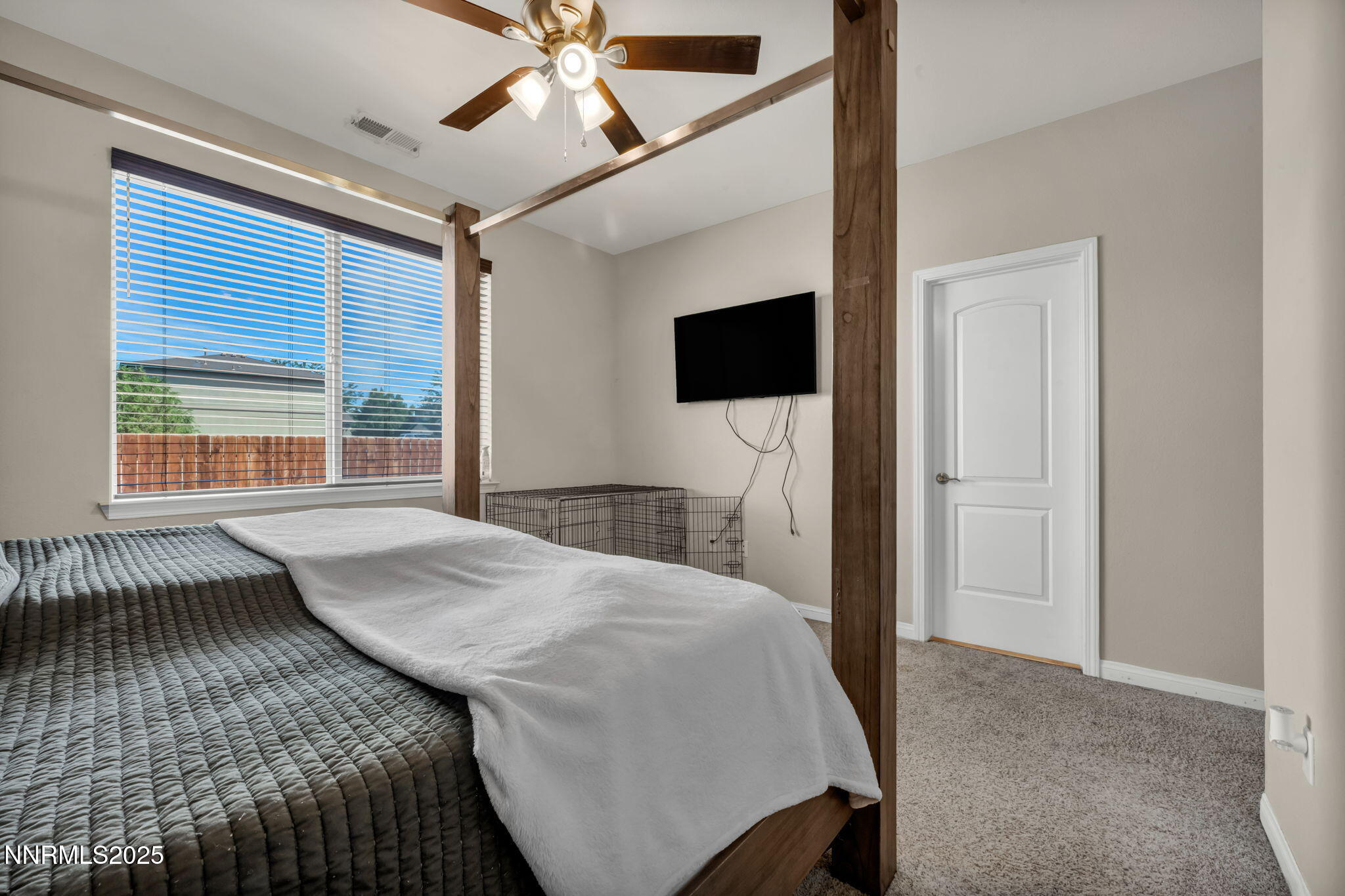 665 Beeghly Drive Fallon, NV 89406 - Photo 18 of 31 a bedroom with a bed and a flat screen tv