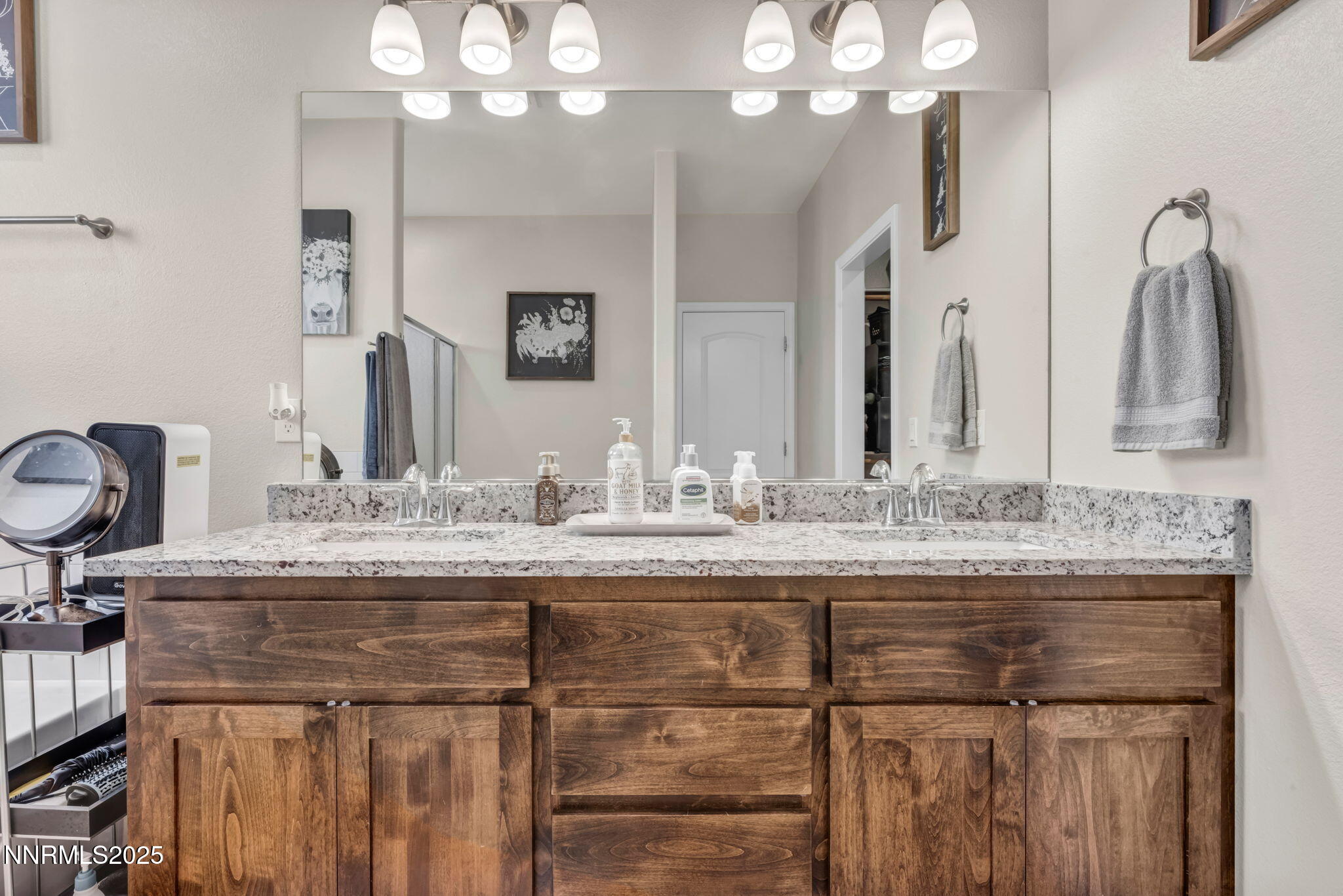 665 Beeghly Drive Fallon, NV 89406 - Photo 24 of 31 a bathroom with a granite countertop sink a large mirror and vanity