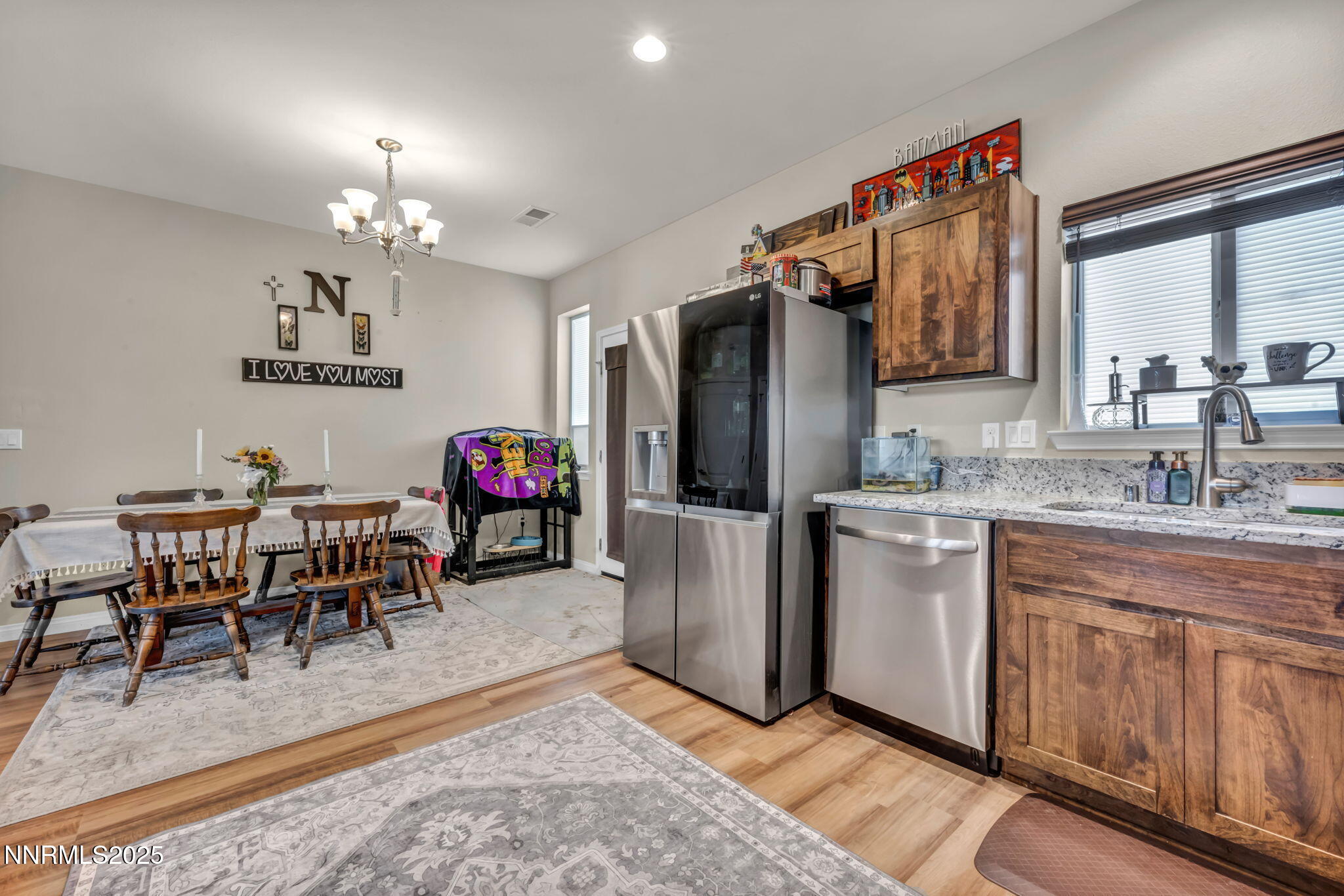 665 Beeghly Drive Fallon, NV 89406 - Photo 8 of 31 a living room with furniture a dining table and a refrigerator