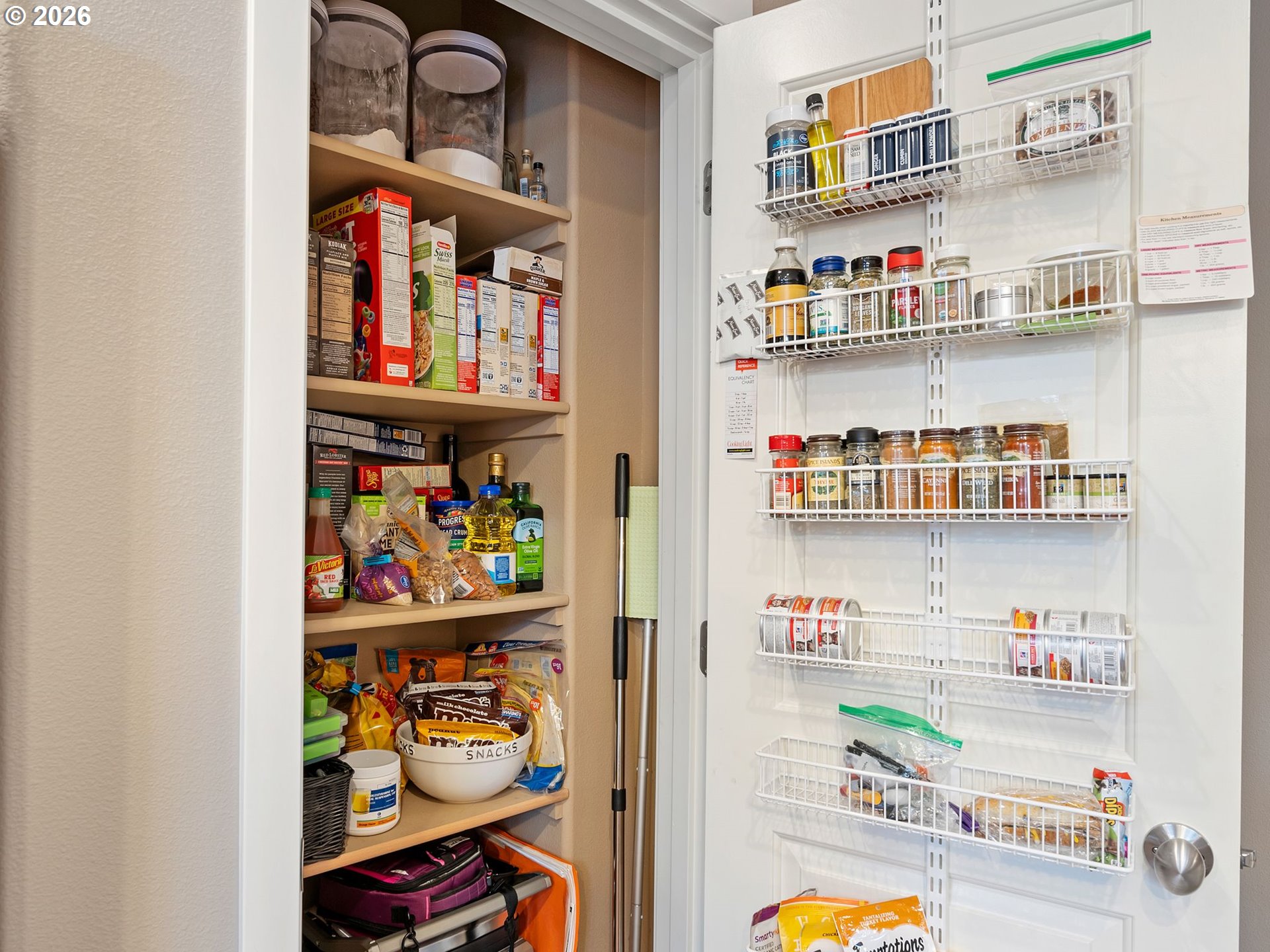 2513 Northwest 3rd Terrace Gresham, OR 97030 - Photo 11 of 38 a room with stainless steel appliances a rug and a book shelf