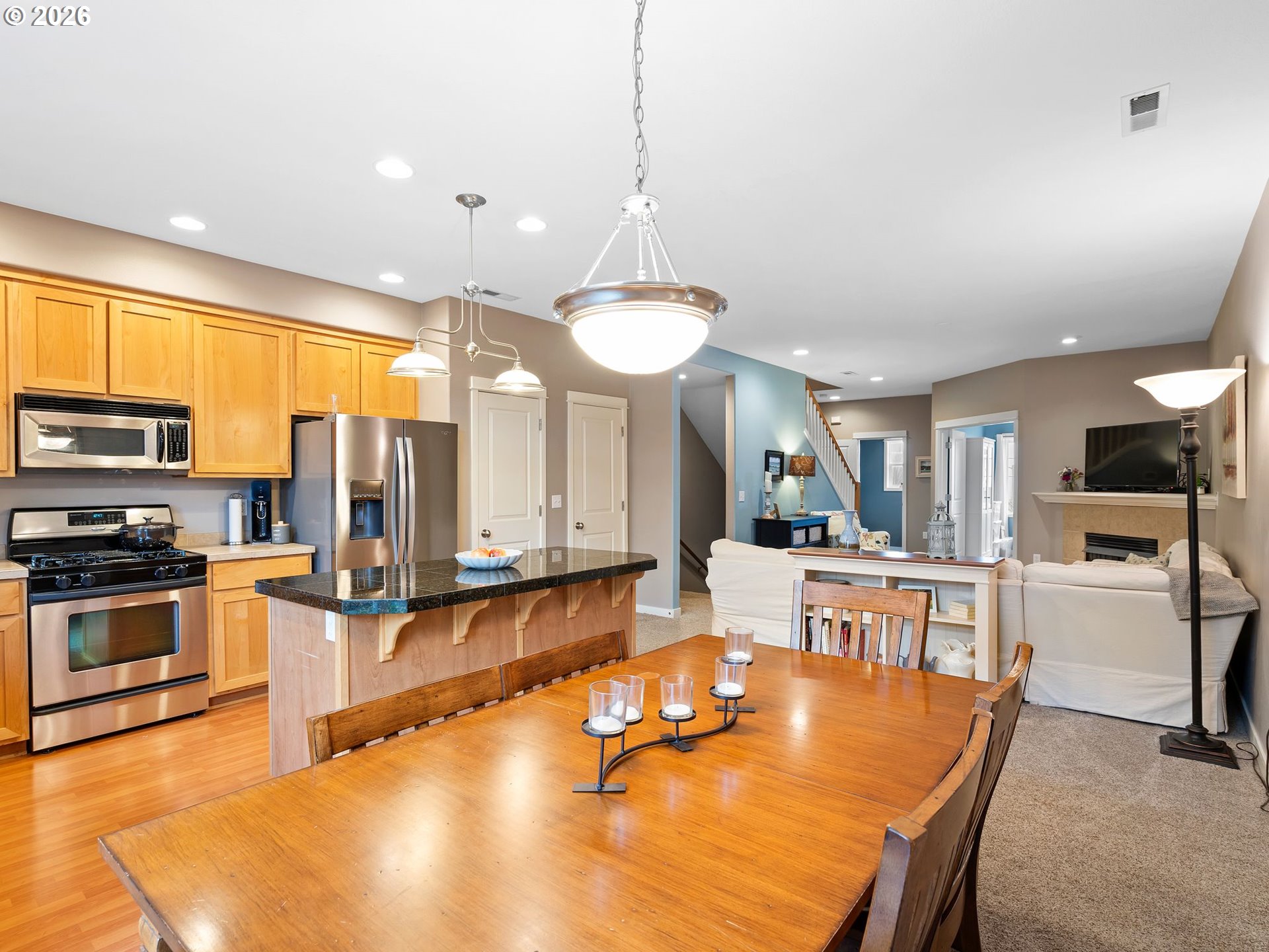 2513 Northwest 3rd Terrace Gresham, OR 97030 - Photo 13 of 38 a large kitchen with a table and chairs