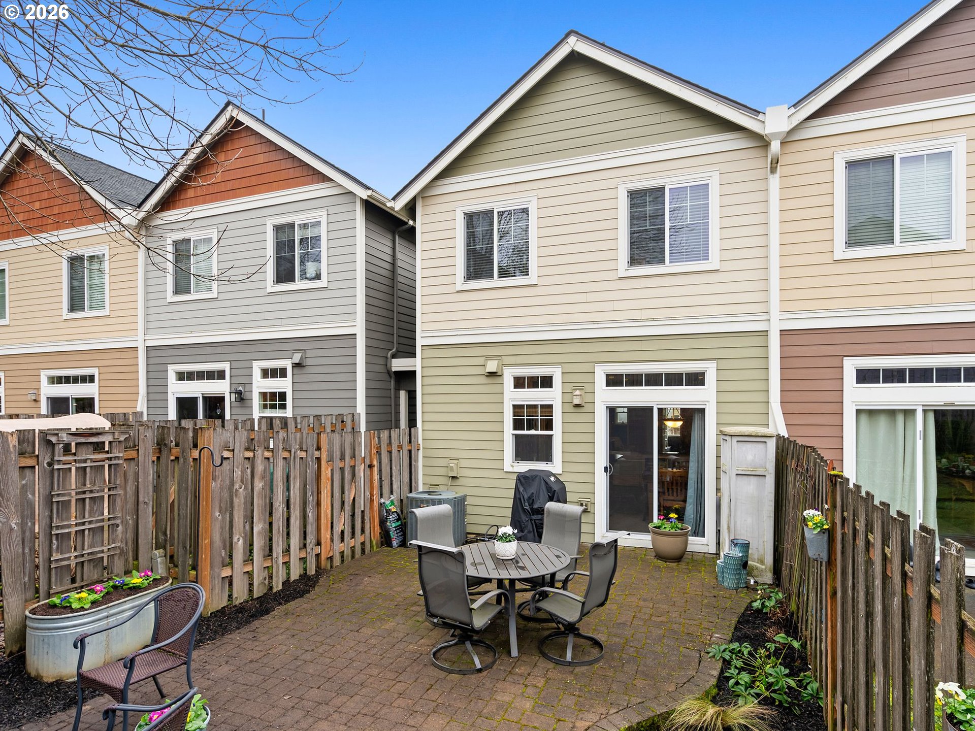 2513 Northwest 3rd Terrace Gresham, OR 97030 - Photo 33 of 38 a patio with table and chairs and potted plants