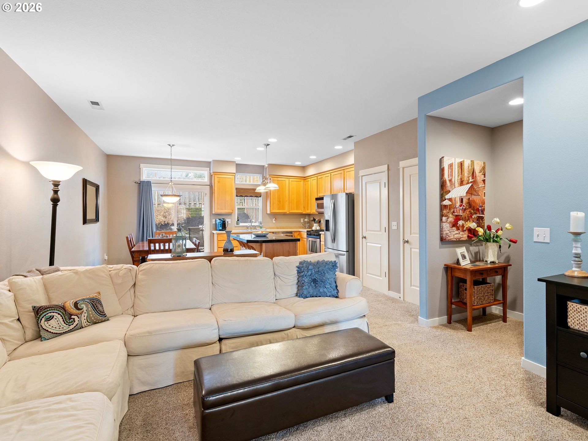 2513 Northwest 3rd Terrace Gresham, OR 97030 - Photo 6 of 38 a living room with furniture and a dining table with kitchen view