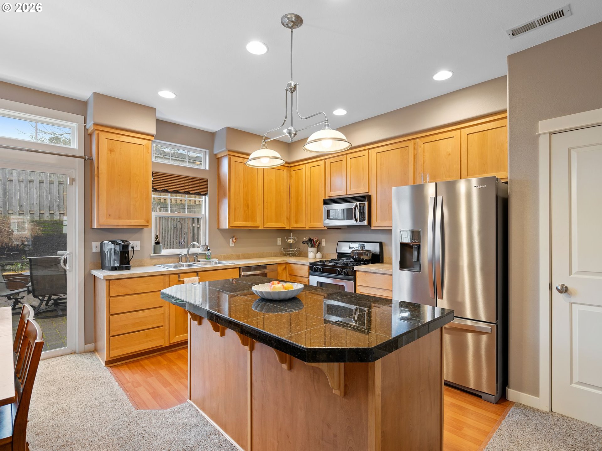 2513 Northwest 3rd Terrace Gresham, OR 97030 - Photo 7 of 38 a kitchen with refrigerator a sink and cabinets