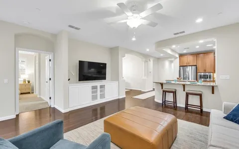 a view of living room with furniture and a window