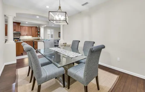 a kitchen with kitchen island wooden cabinets and stainless steel appliances