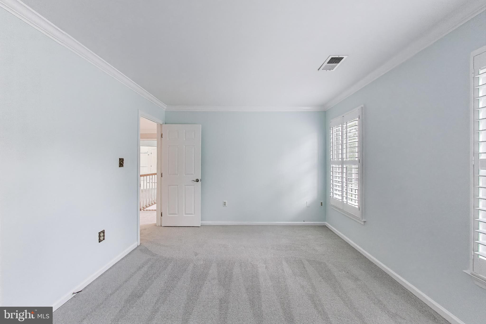 10106 Waterside Drive Burke, VA 22015 - Photo 17 of 30 a view of an empty room with a window