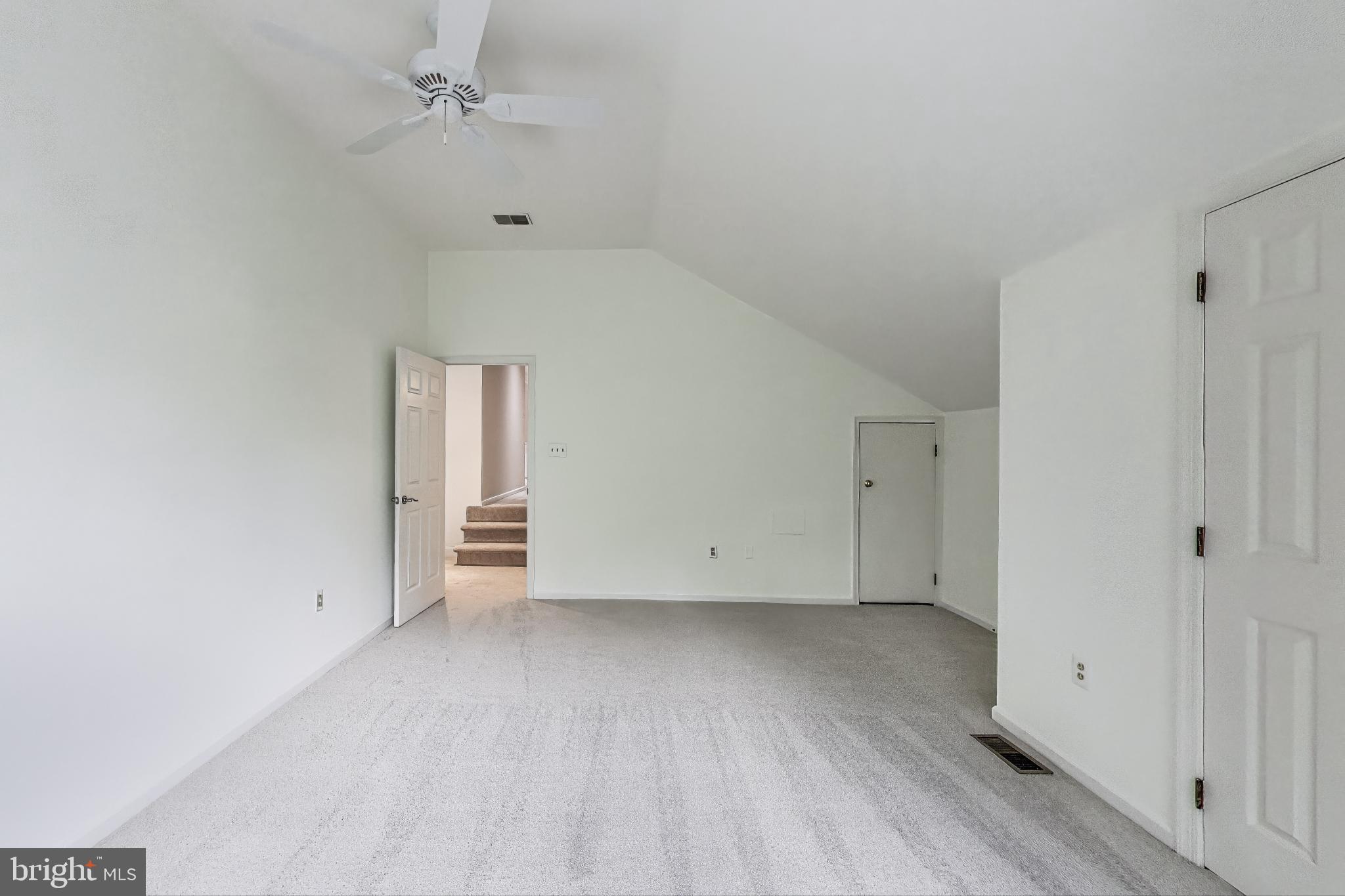 10106 Waterside Drive Burke, VA 22015 - Photo 19 of 30 a view of an empty room with wooden floor