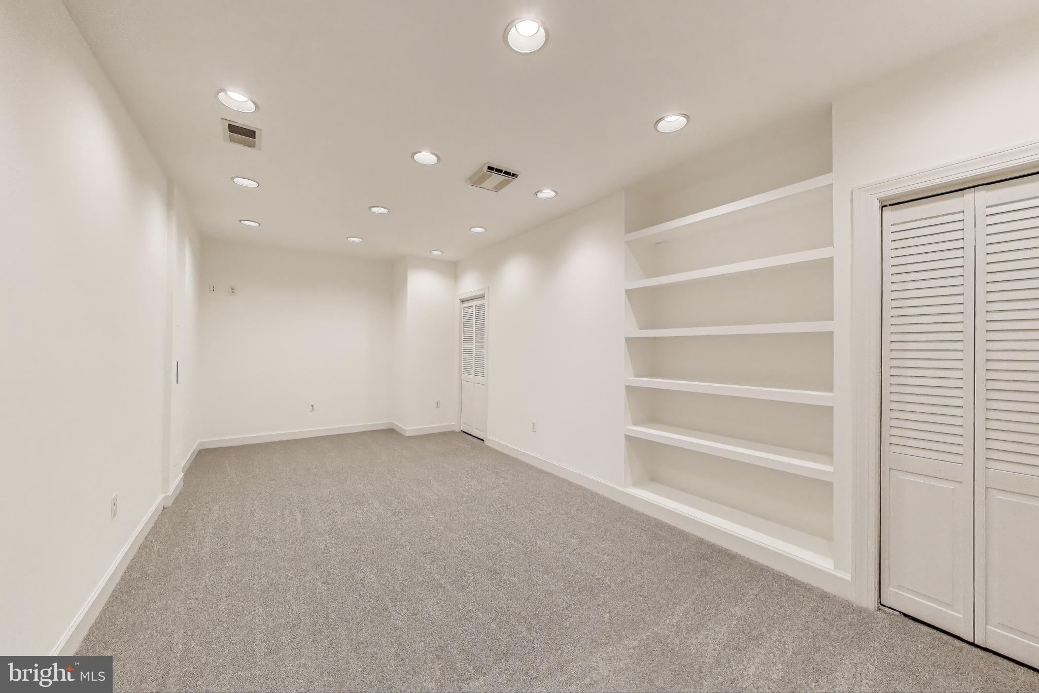 10106 Waterside Drive Burke, VA 22015 - Photo 22 of 30 a view of an empty room with a window