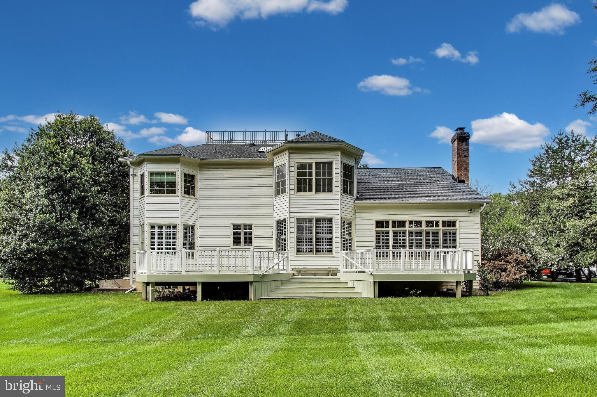 10106 Waterside Drive Burke, VA 22015 - Photo 24 of 30 a view of a house with a backyard porch and sitting area