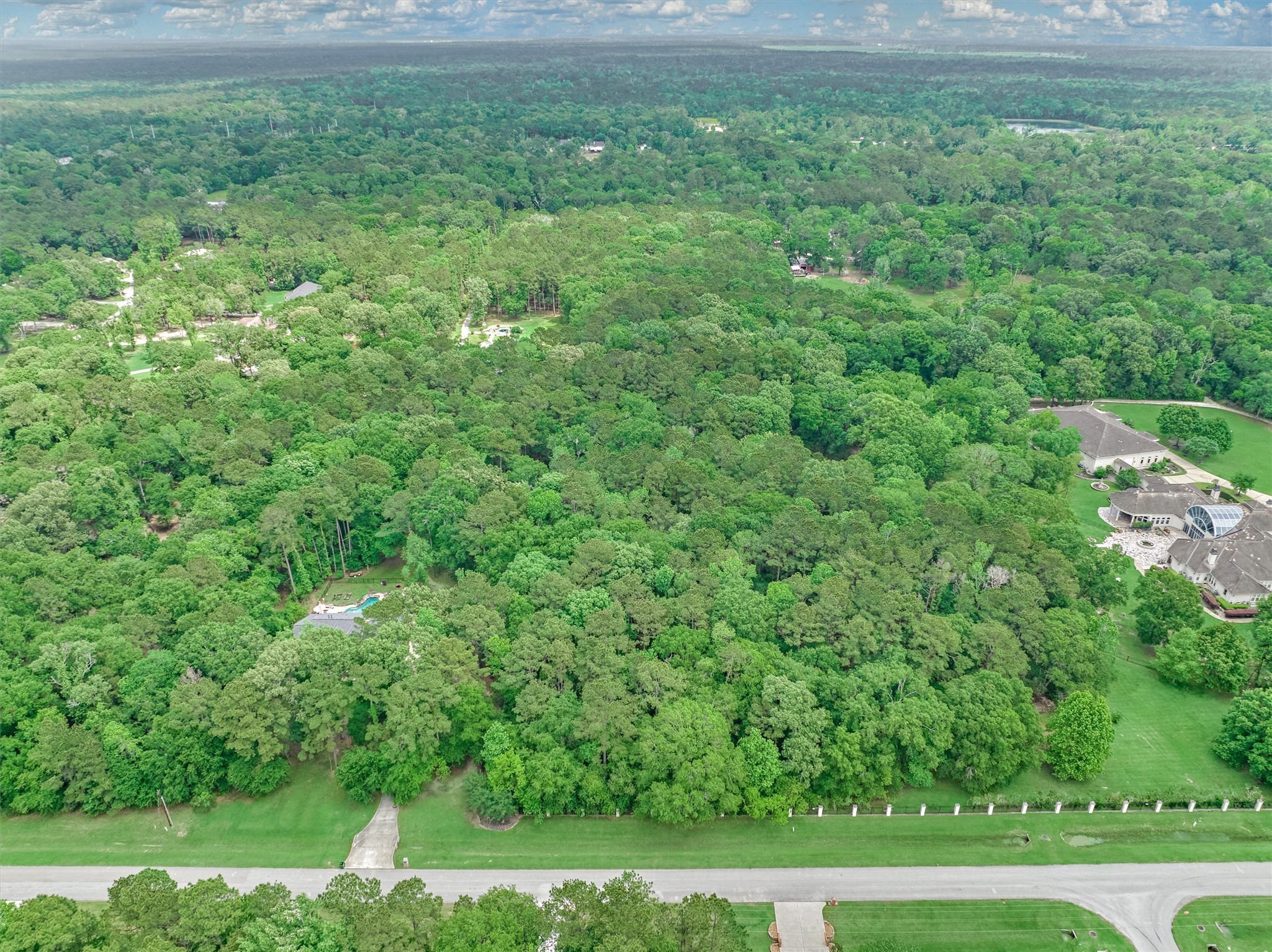 0 Lake Commons Way Huffman, TX 77336 - Photo 6 of 13 a view of a lush green field