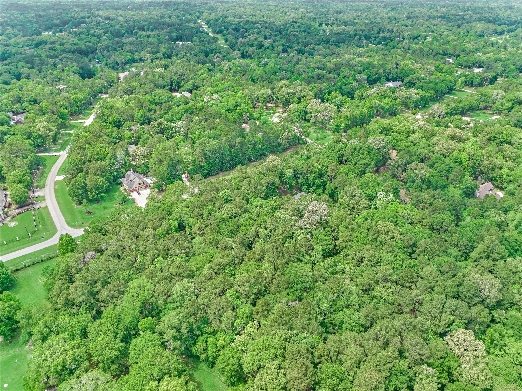 0 Lake Commons Way Huffman, TX 77336 - Photo 8 of 13 an aerial view of residential house with outdoor space and trees all around
