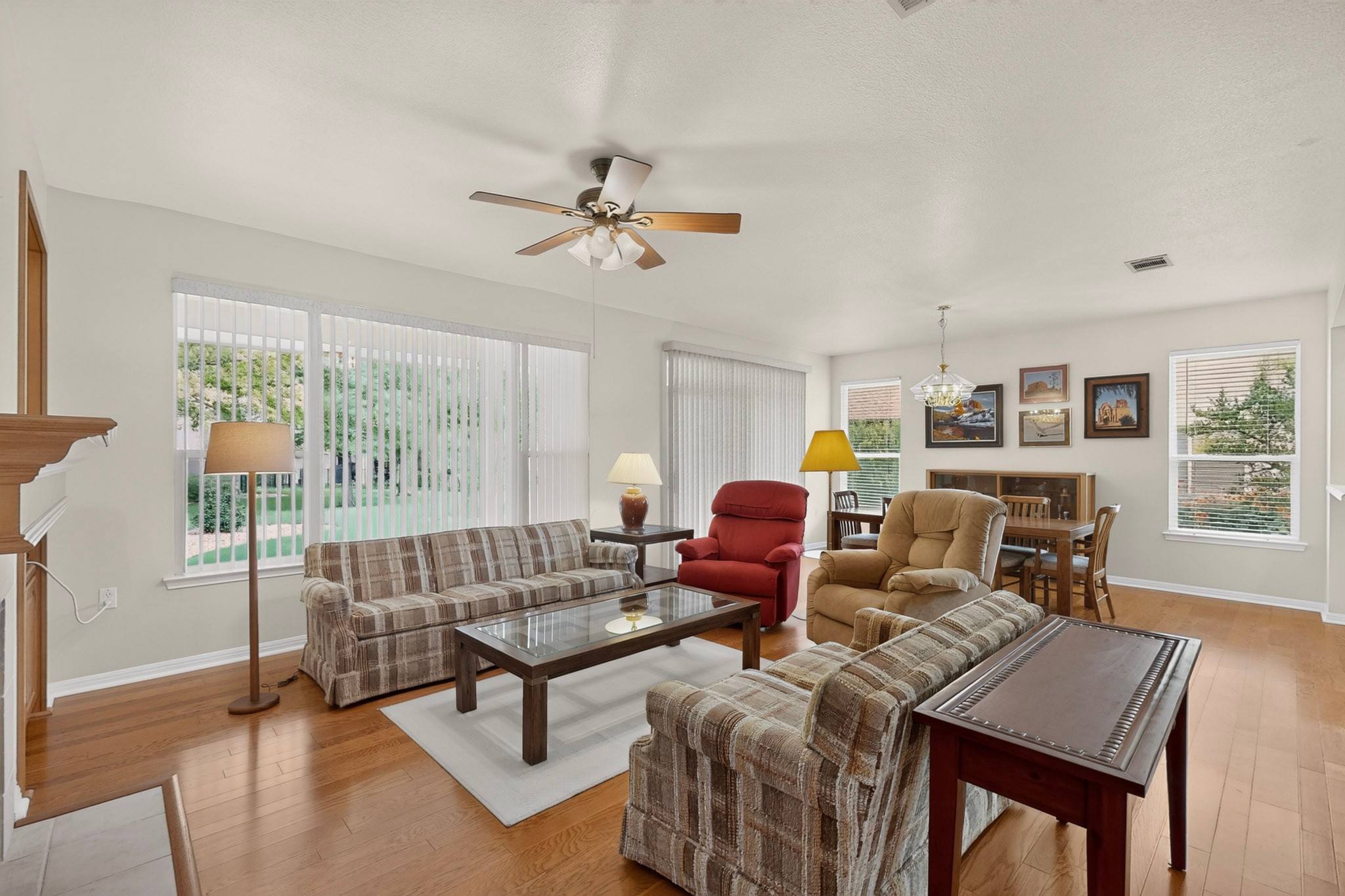 207 Red Poppy Trail Georgetown, TX 78633 - Photo 7 of 31 Hardwood floors and generous windows frame this inviting gathering space.